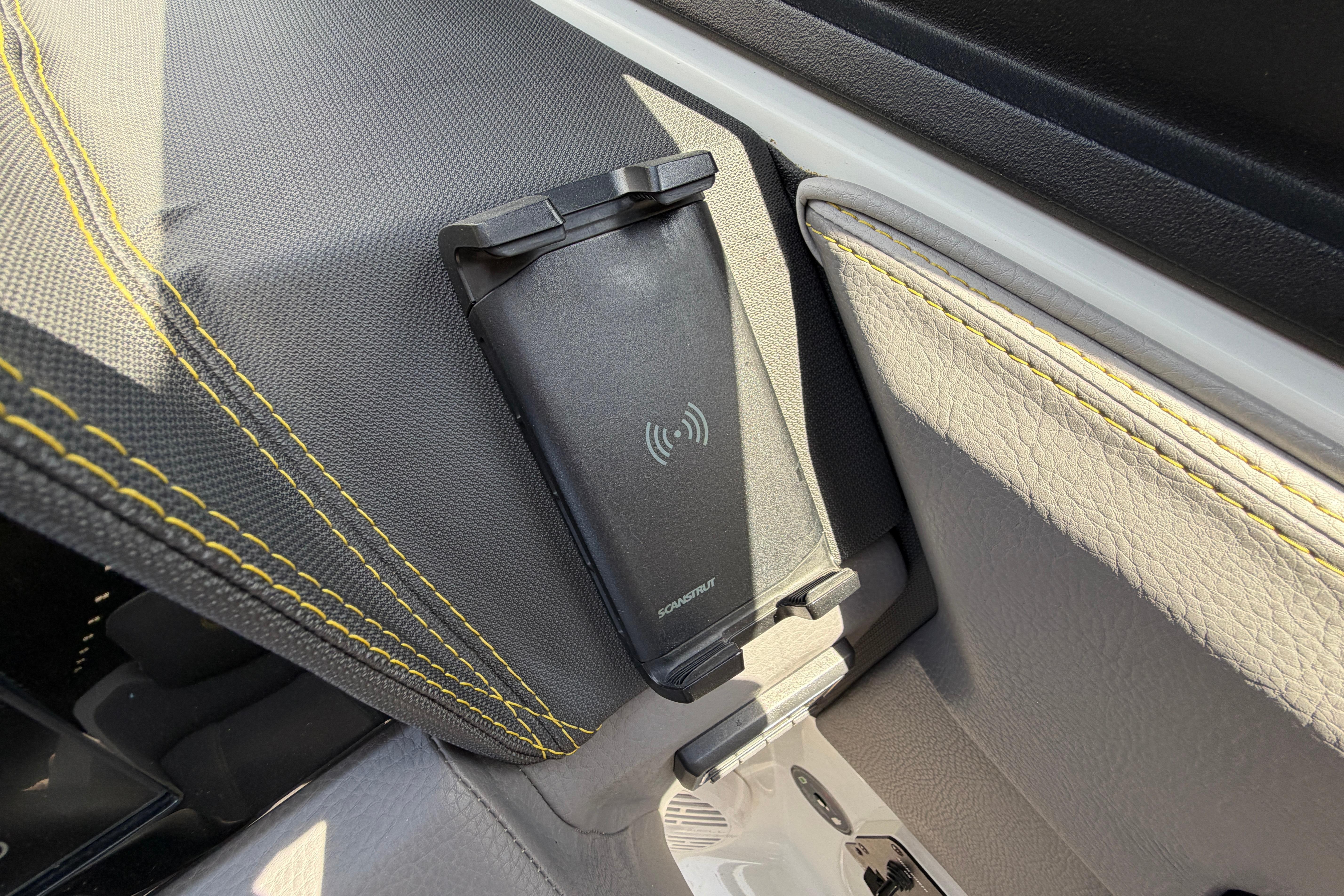 Close-up of a phone holder in a Cobalt R8 Surf boat.