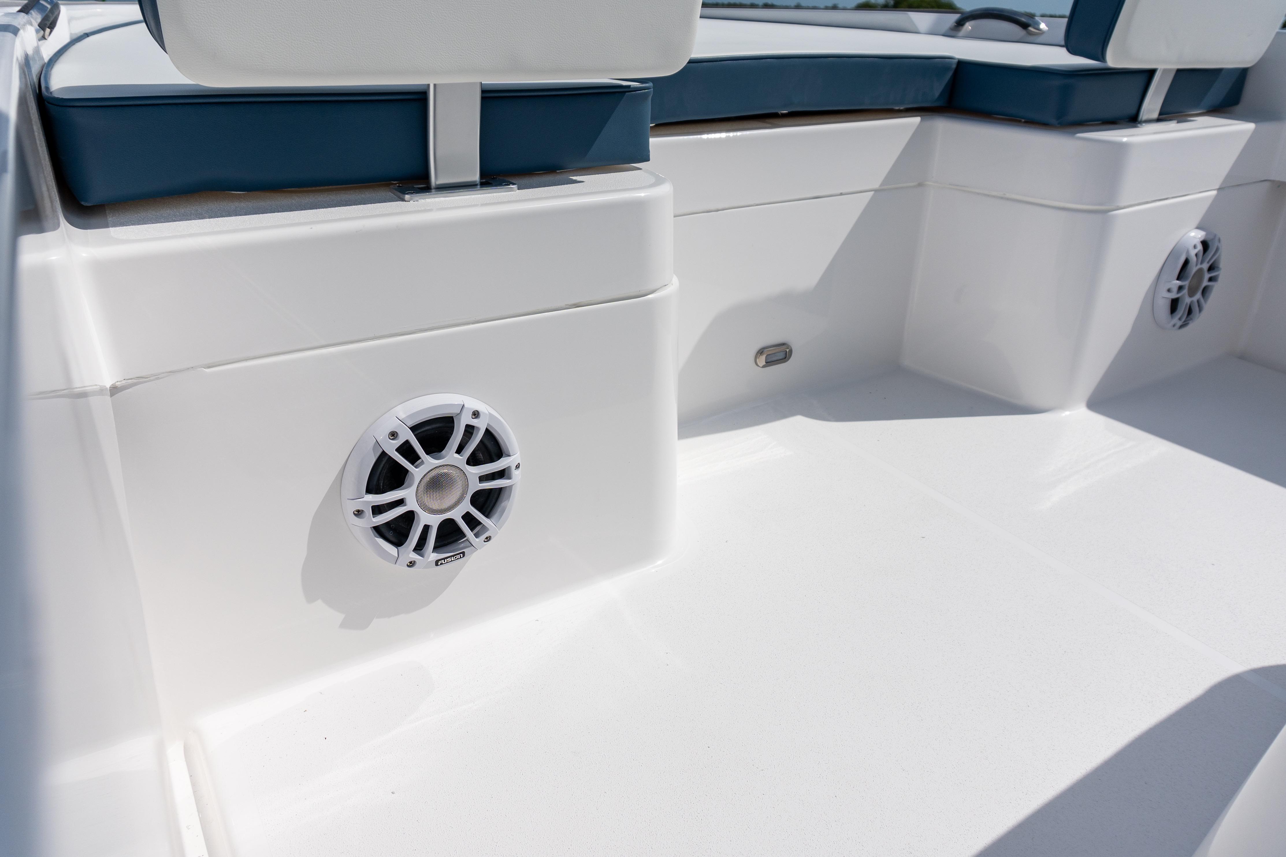 2026 Twin Vee 22 BayCat interior with white speakers and cushioned seating.