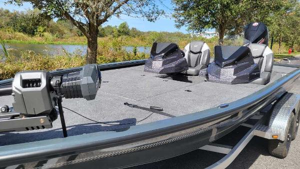 2025 Ranger ALPHA 208 fishing boat with advanced seating and equipment on a sunny day.