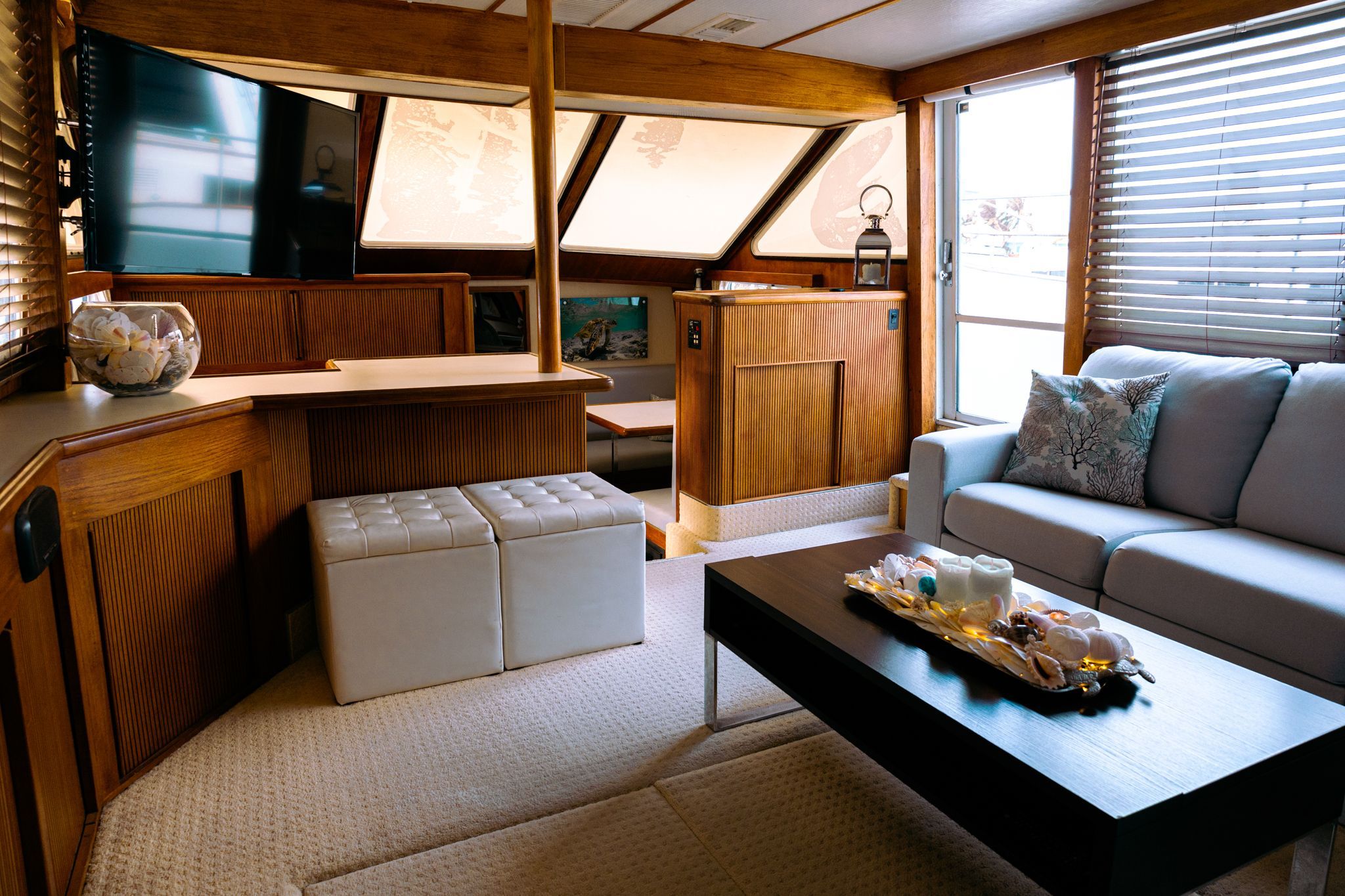 Interior of a 1991 Tollycraft 44 Cockpit Motor Yacht featuring a cozy living area.