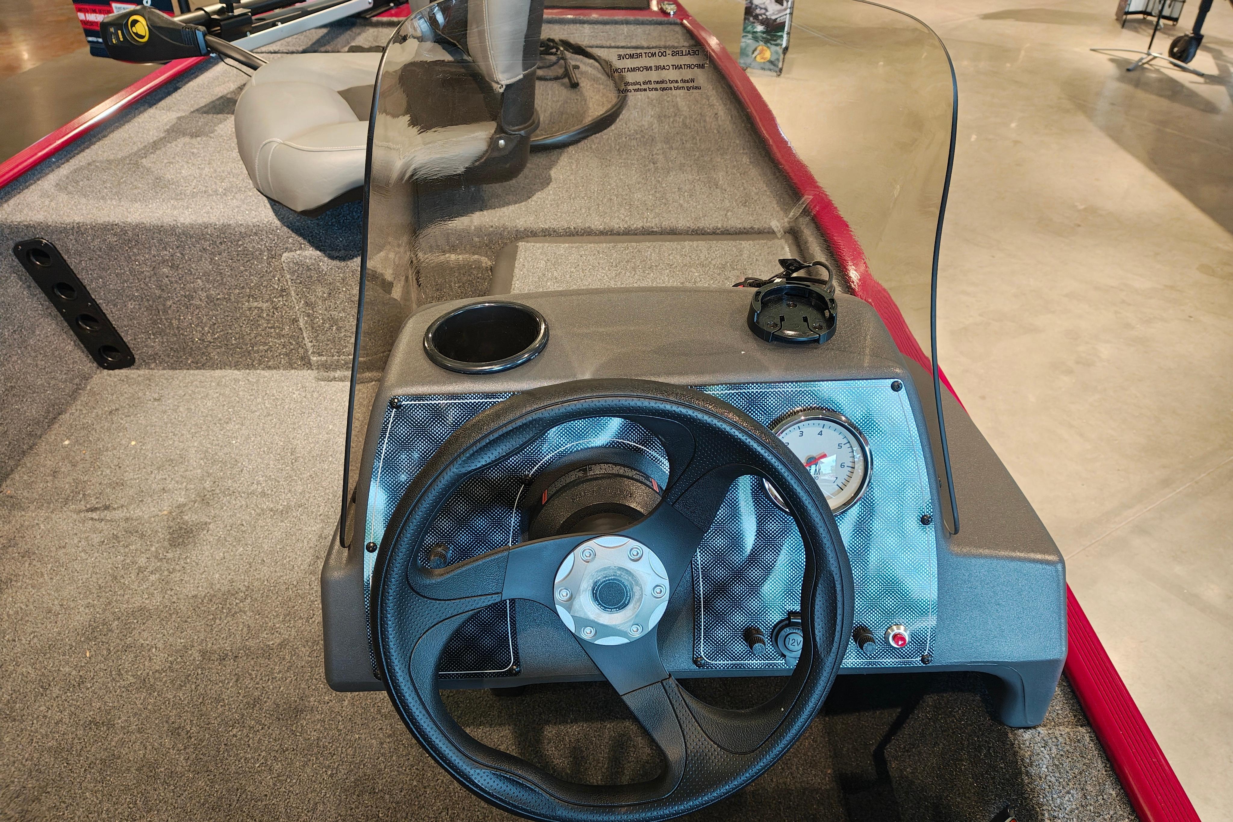 2026 Tracker Bass Tracker Classic XL boat dashboard with steering wheel and gauges.