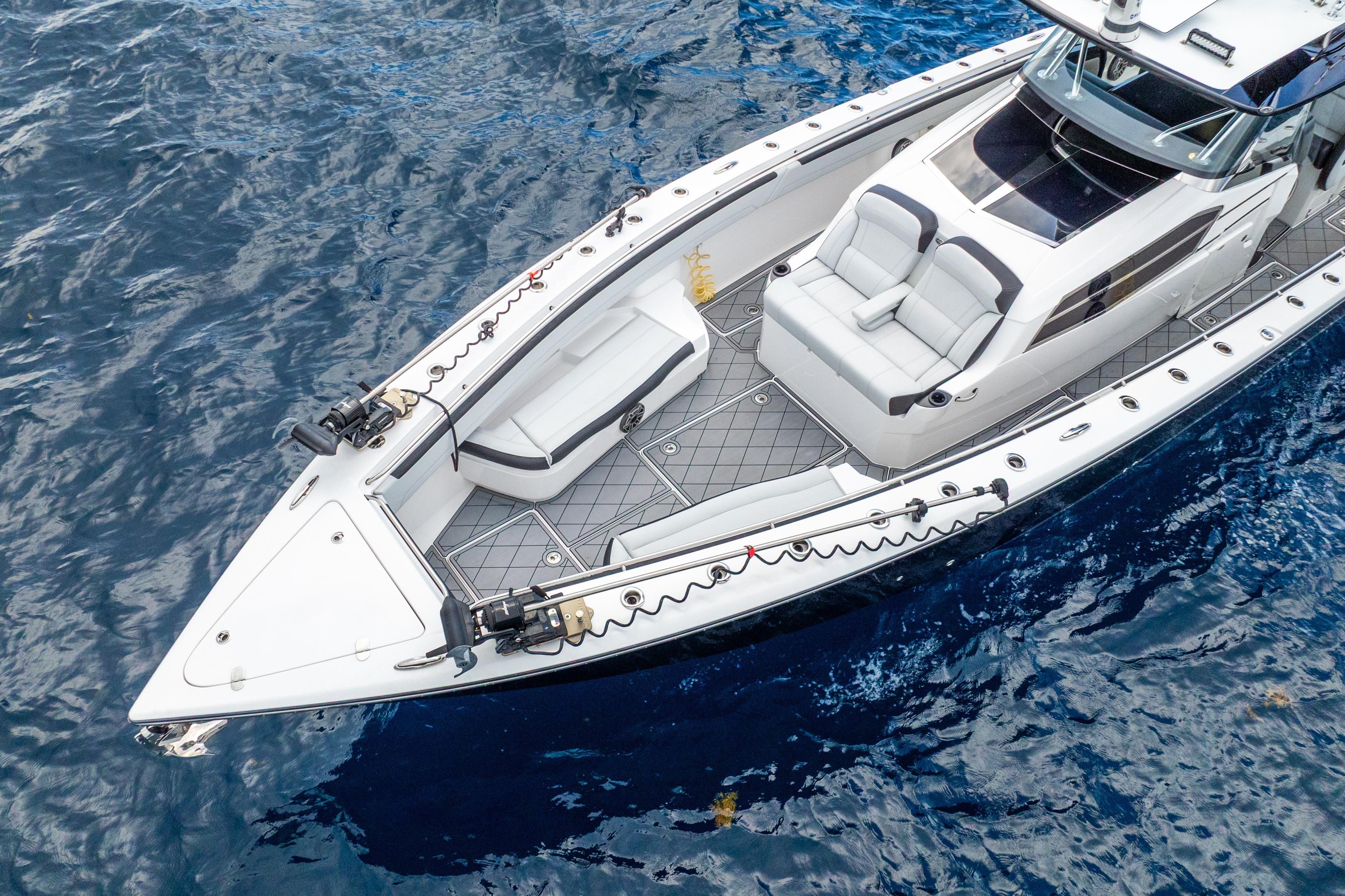 2024 Nor-Tech 452 Super Fish boat on blue ocean water, aerial view.