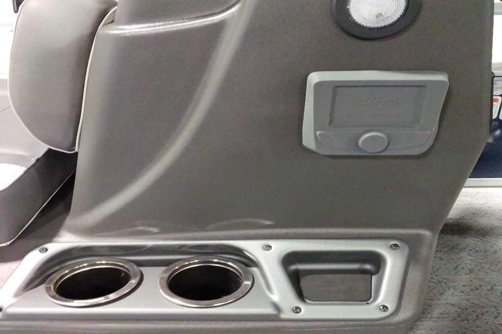 2026 Sun Tracker Bass Buggy 18 DLX console with cup holders and storage compartment.
