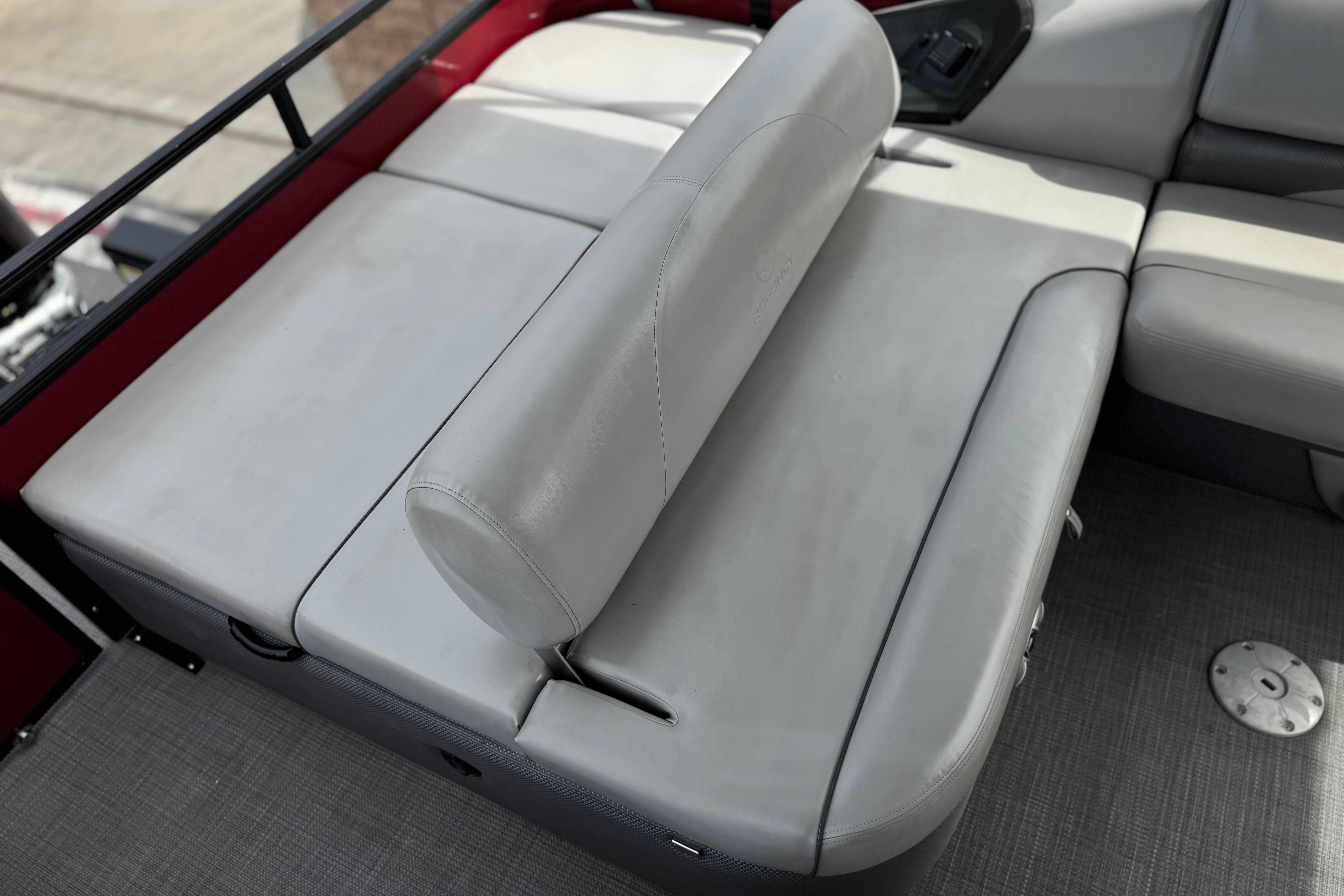 2022 Regency 250 DL3 boat interior with gray cushioned seating.