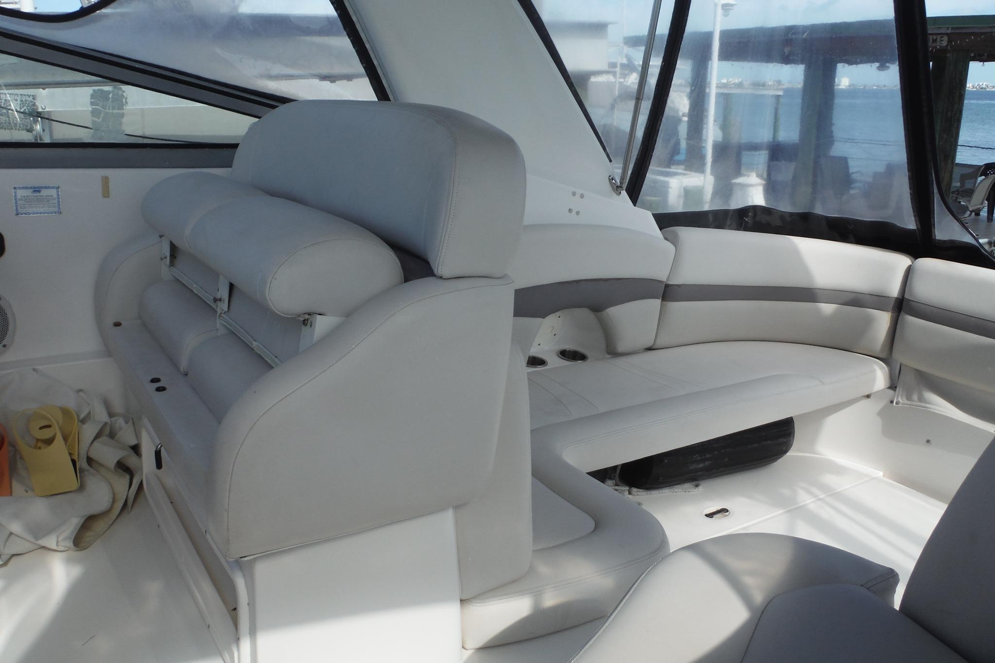 2005 Chaparral Signature 350 boat interior with white seating and panoramic windows.