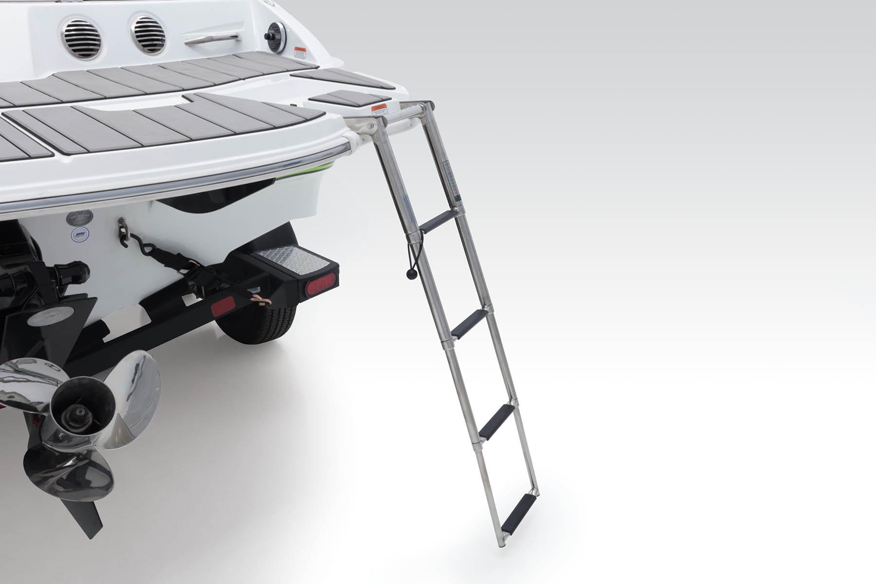 2023 Tahoe 210 Si Limited boat with extended swim ladder and propeller.