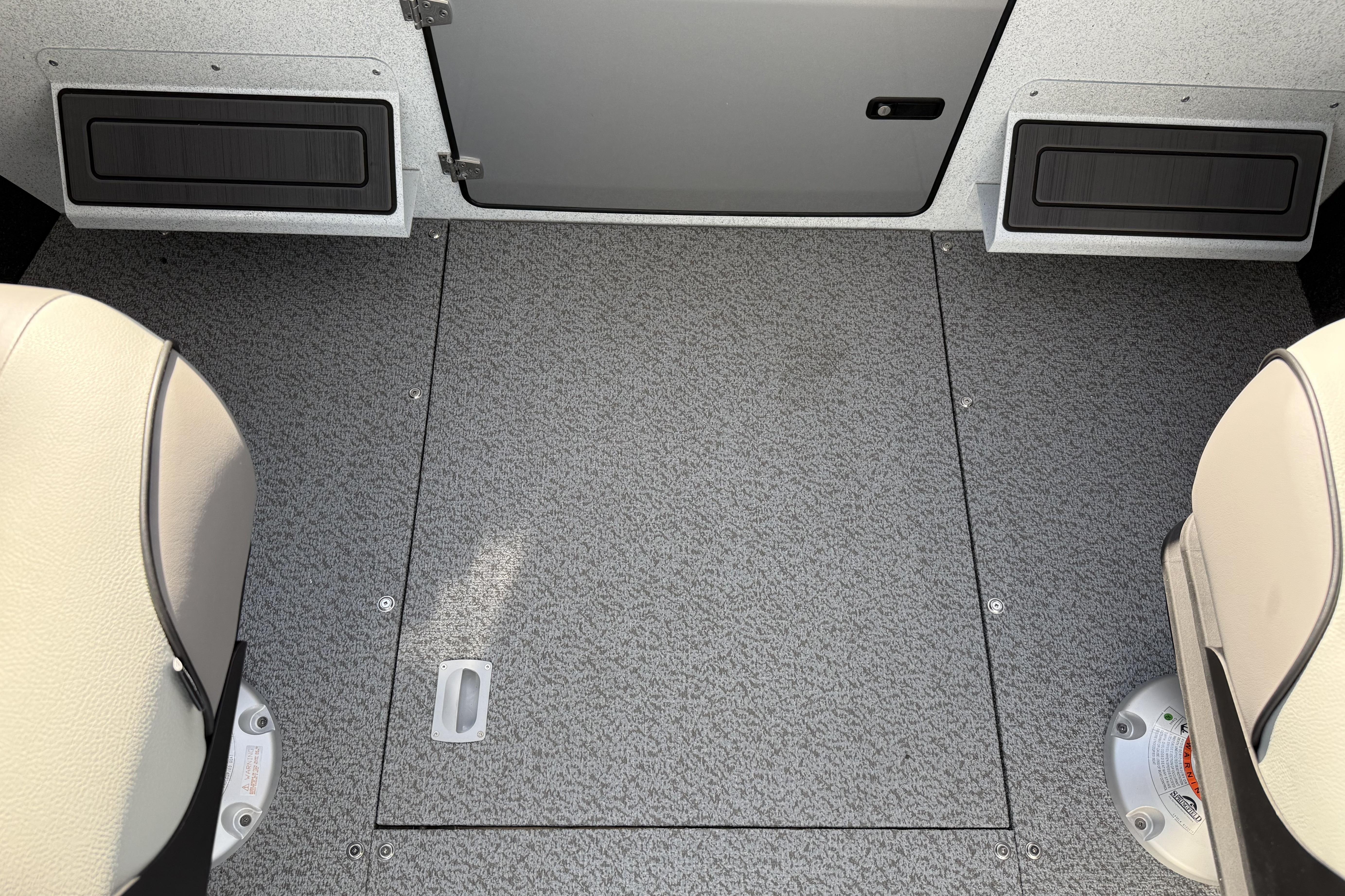 Interior view of 2026 KingFisher 2425 Escape HT boat, featuring seating and storage compartments.