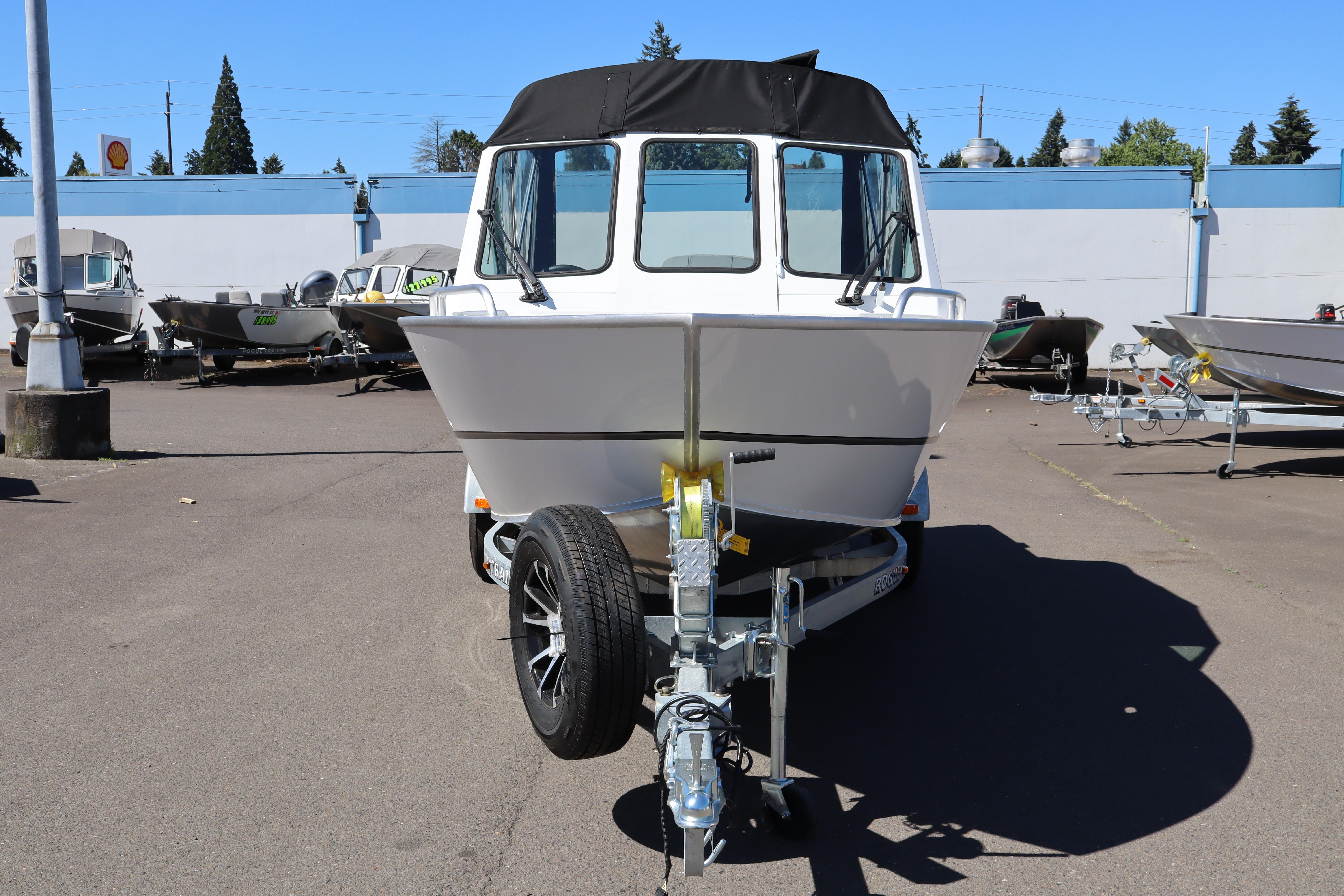 2026 Alumaweld Stryker 202 boat on trailer in outdoor dealership lot.