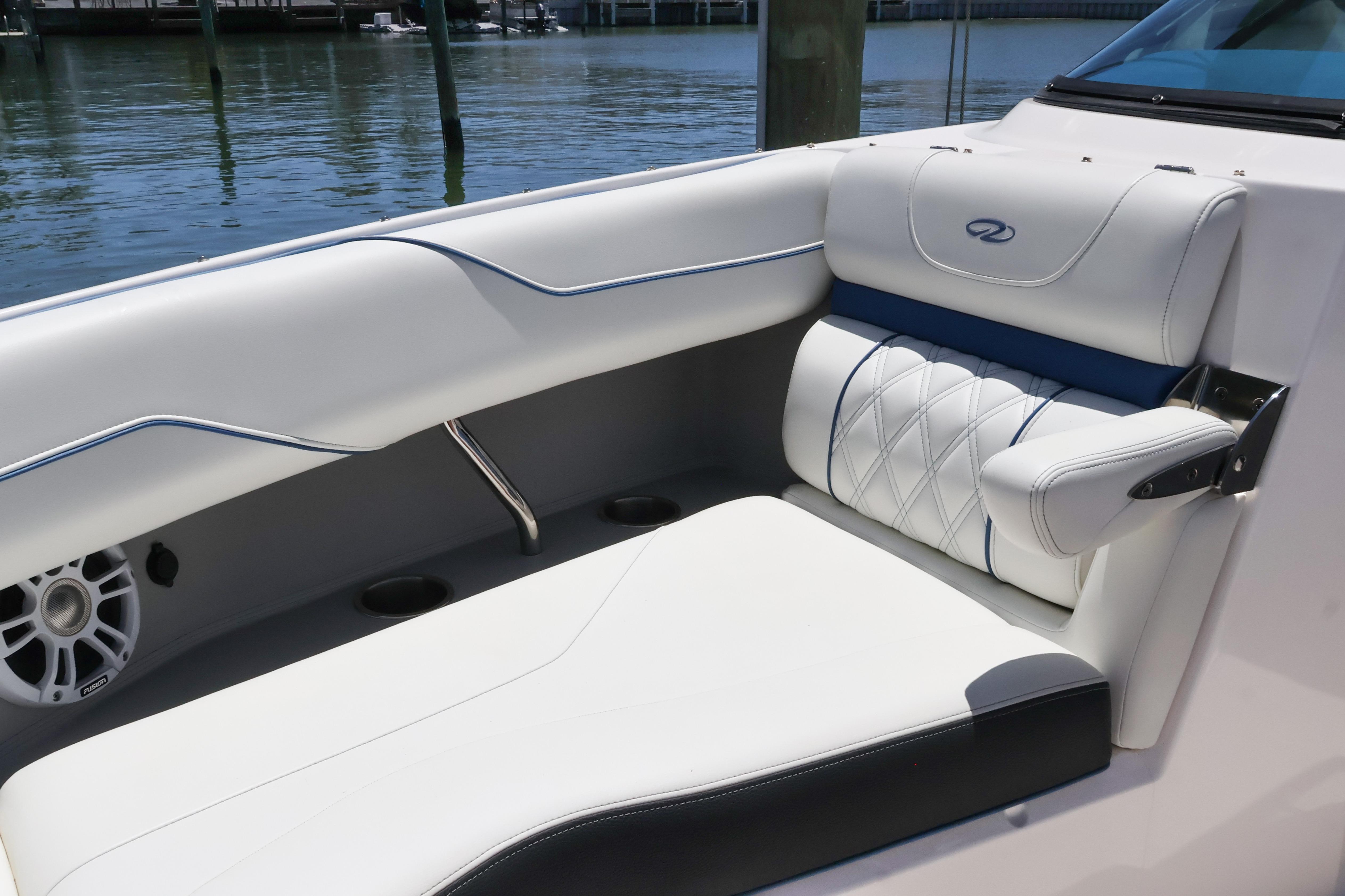 Luxurious seating on a 2020 Regal LX4 boat, featuring elegant white upholstery and stylish design.