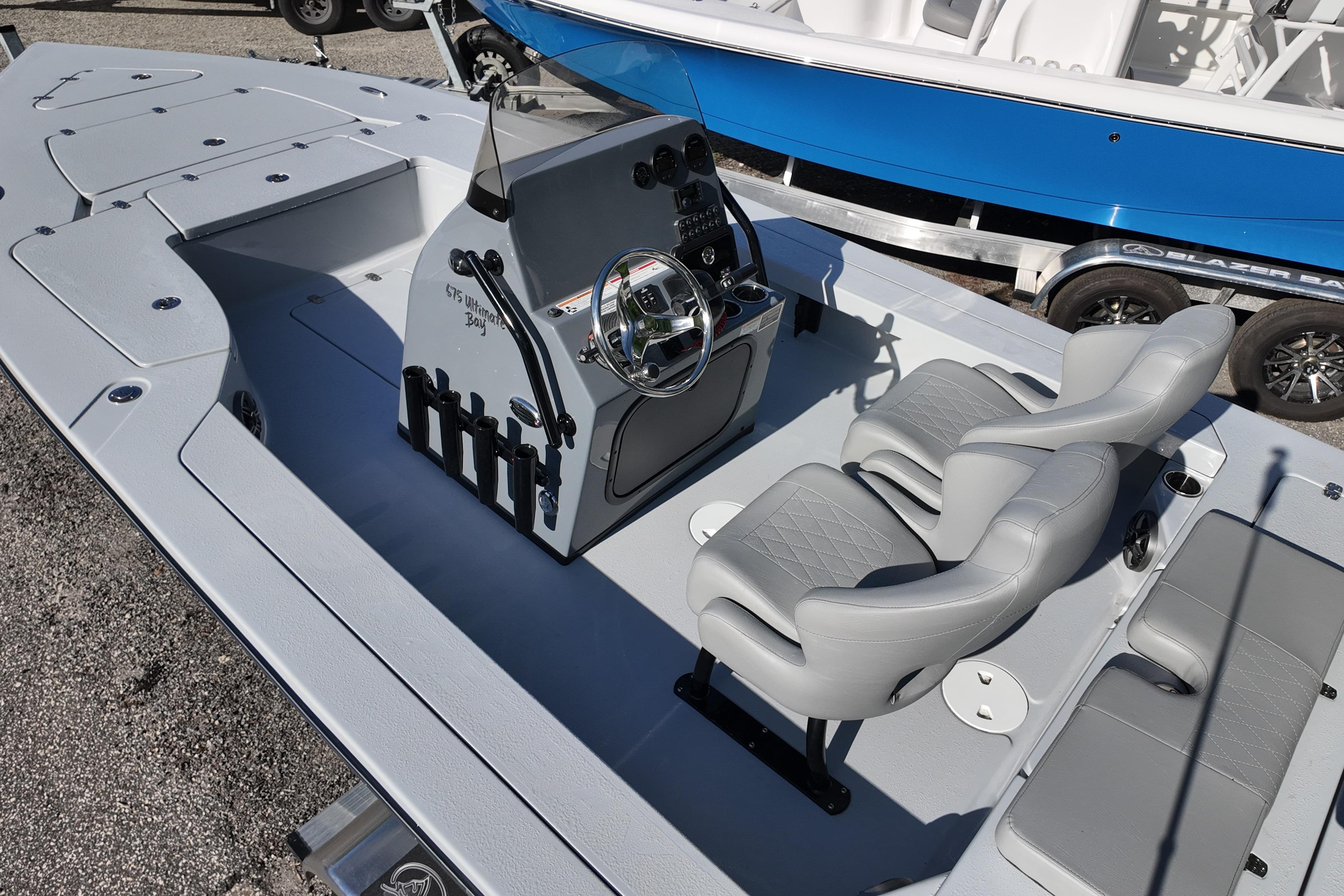 2026 Blazer Bay 675 Ultimate Bay boat interior with dual seats and steering console.