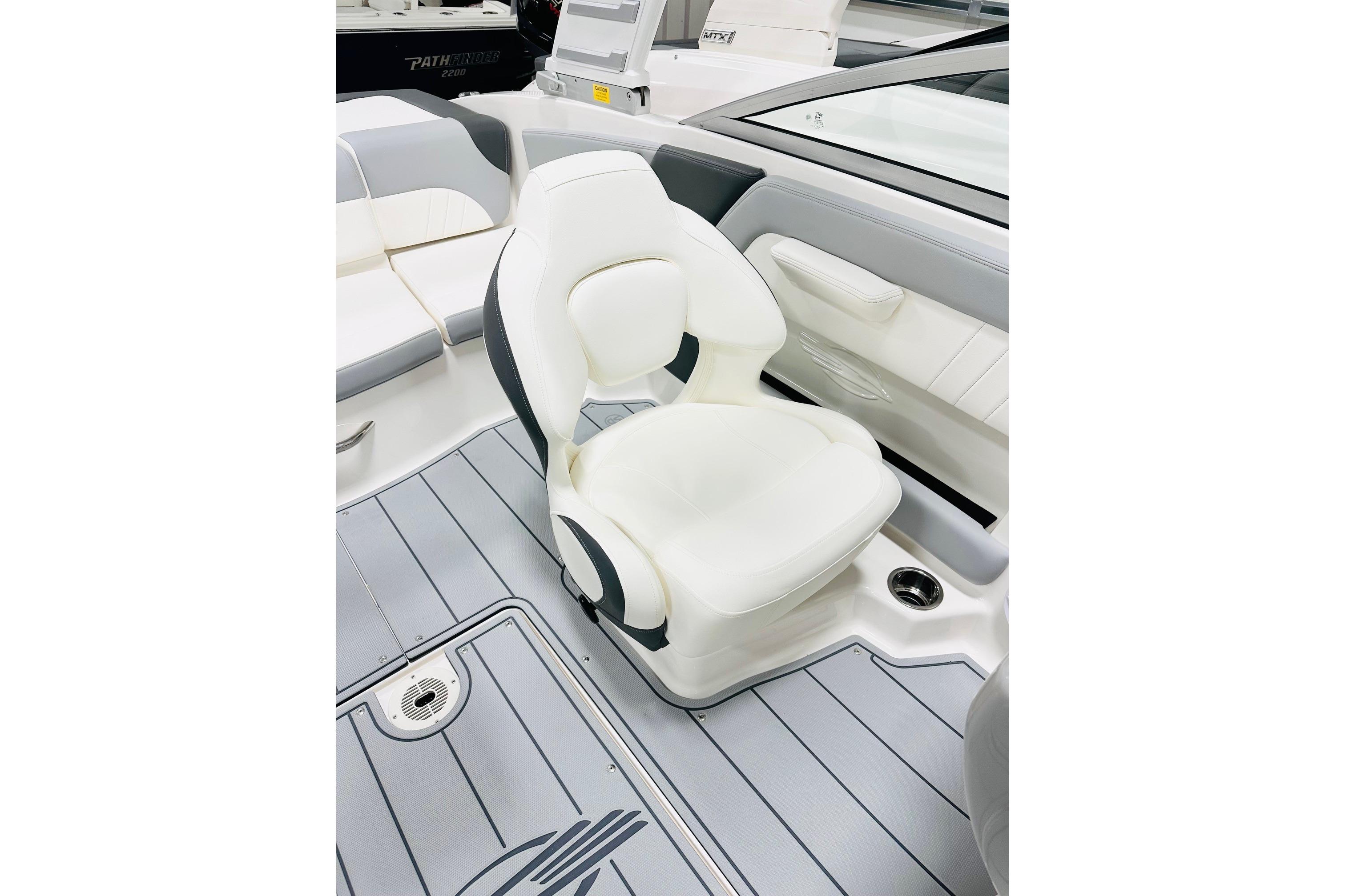 2025 Chaparral 21 SSi OB boat interior with white seating and sleek design.