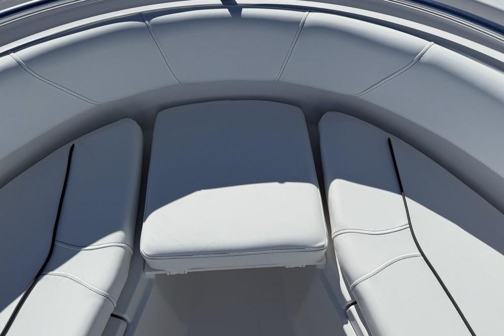 2026 Sportsman Open 232 Center Console boat interior with cushioned seating.