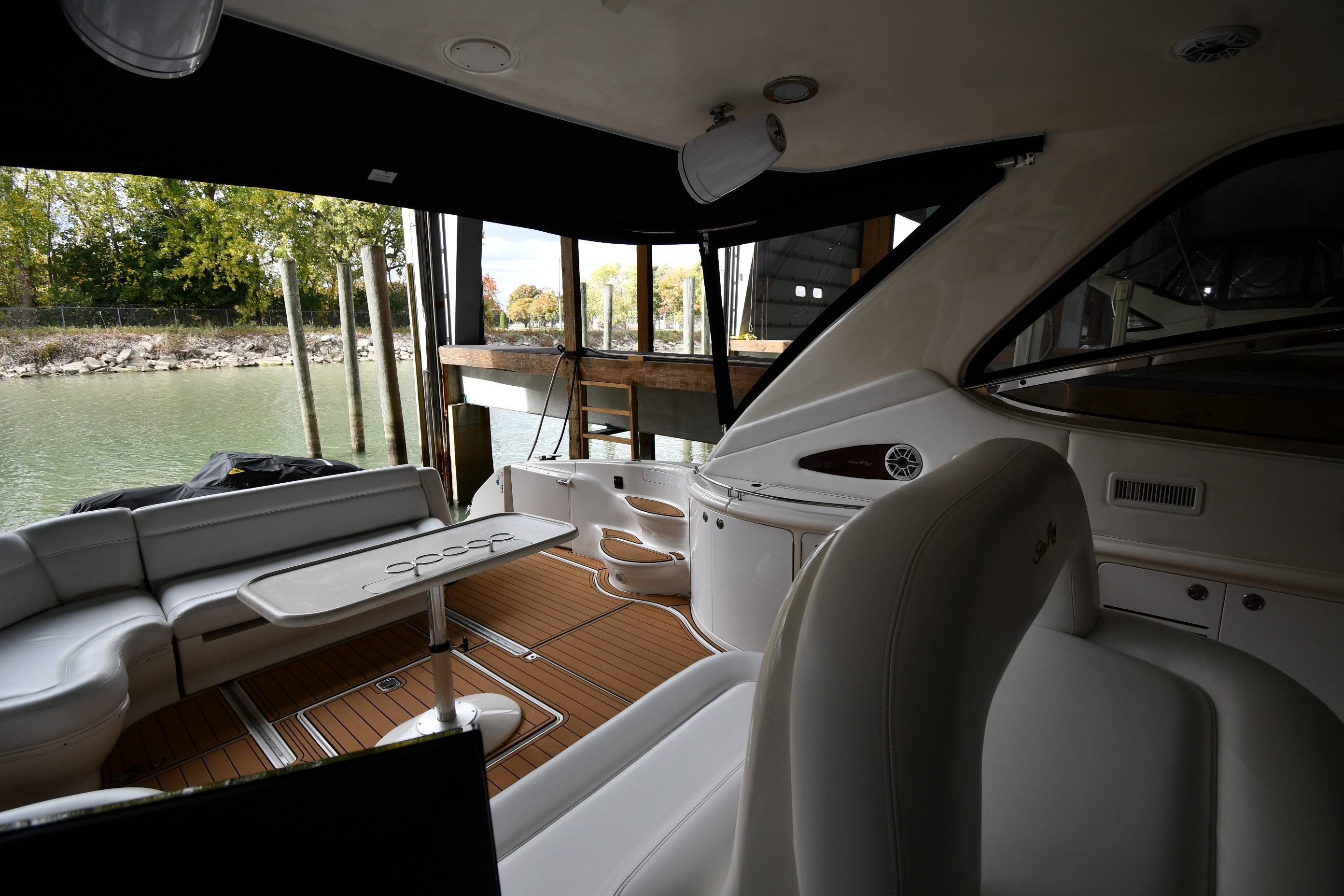 Interior of 2001 Sea Ray 540 Sundancer yacht with elegant seating and table setup.