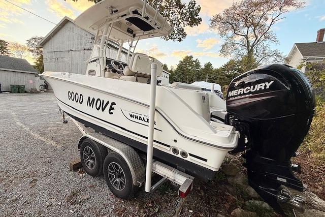 2018 Boston Whaler 230 Outrage boat on trailer with Mercury engine, labeled "Good Move."