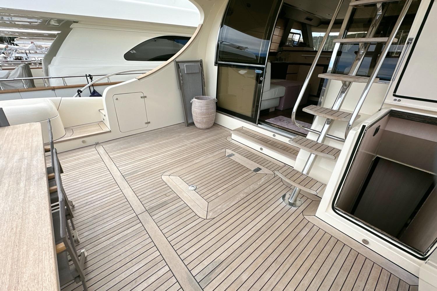 Luxurious 2010 Abati Yachts 64 Freeport deck with elegant wood finish and modern design.