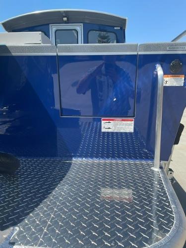 2025 Spartan 240 Maximus Pro with blue exterior and diamond plate flooring.