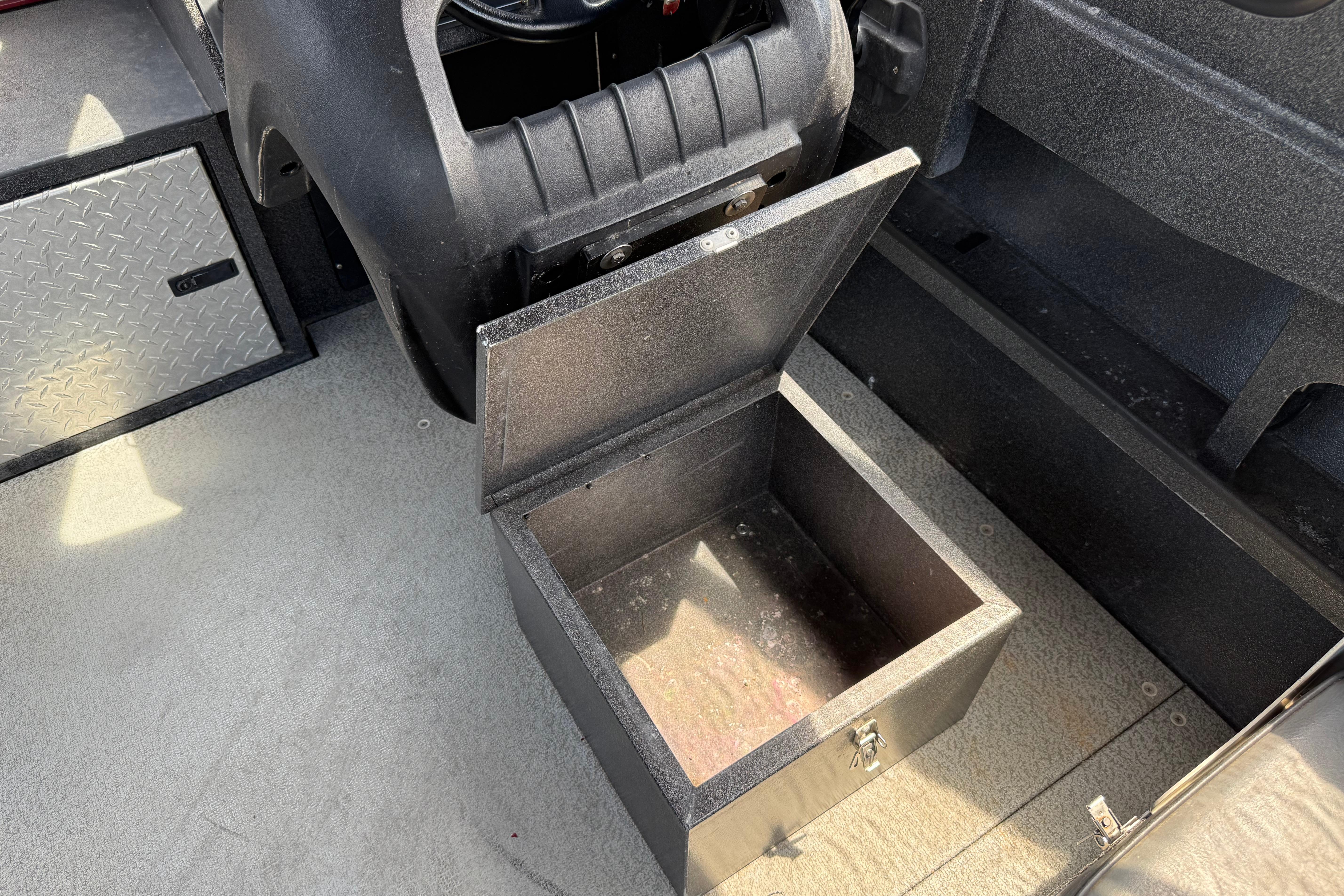 Open storage compartment in a 2005 Willie Raptor 21' boat interior.