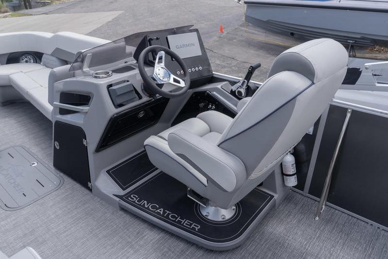 2026 SunCatcher Elite 326 SL boat cockpit with Garmin navigation system and luxurious seating.