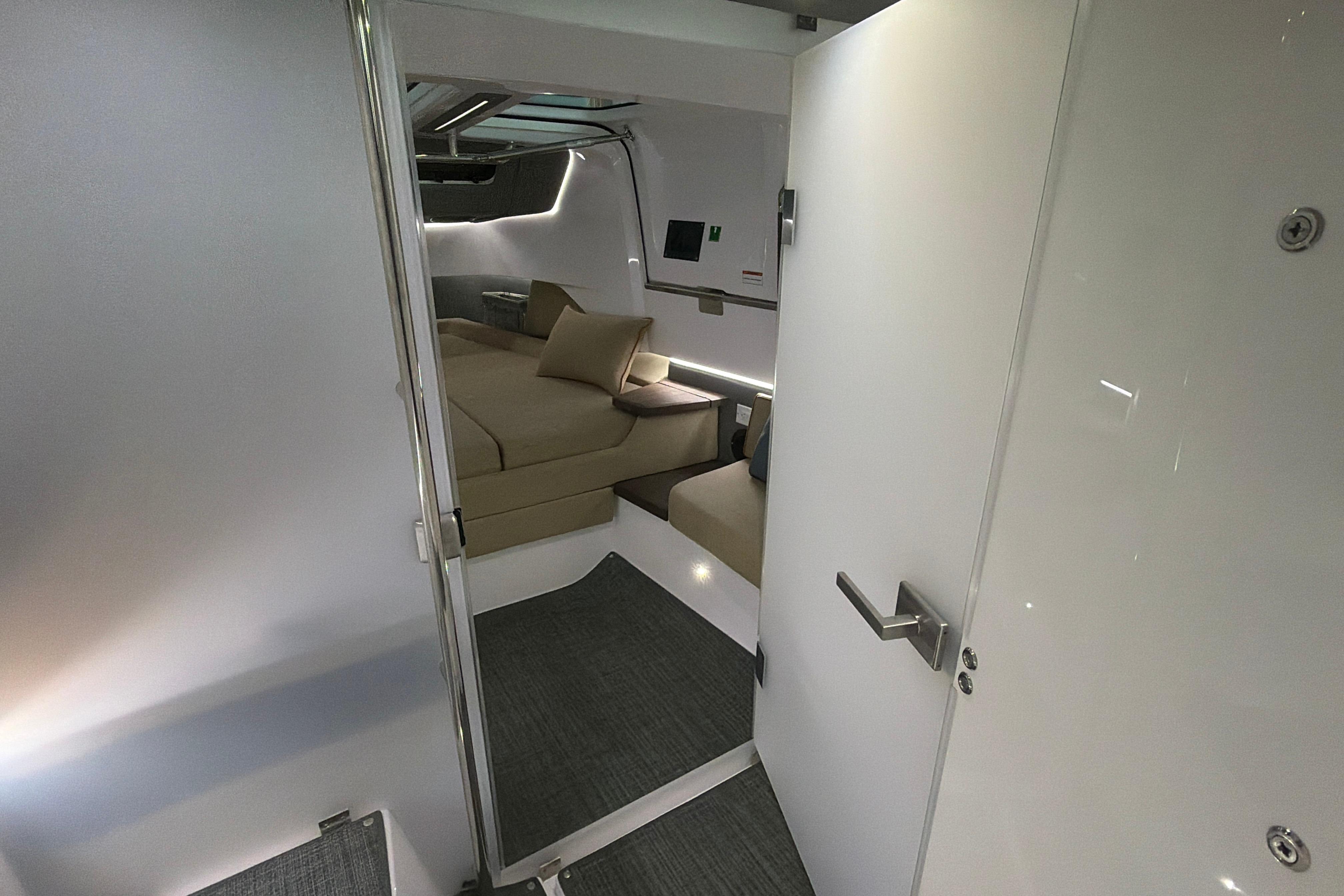 Interior of 2022 Axopar Brabus 37 XC Cross Cabin, featuring modern seating and sleek design.
