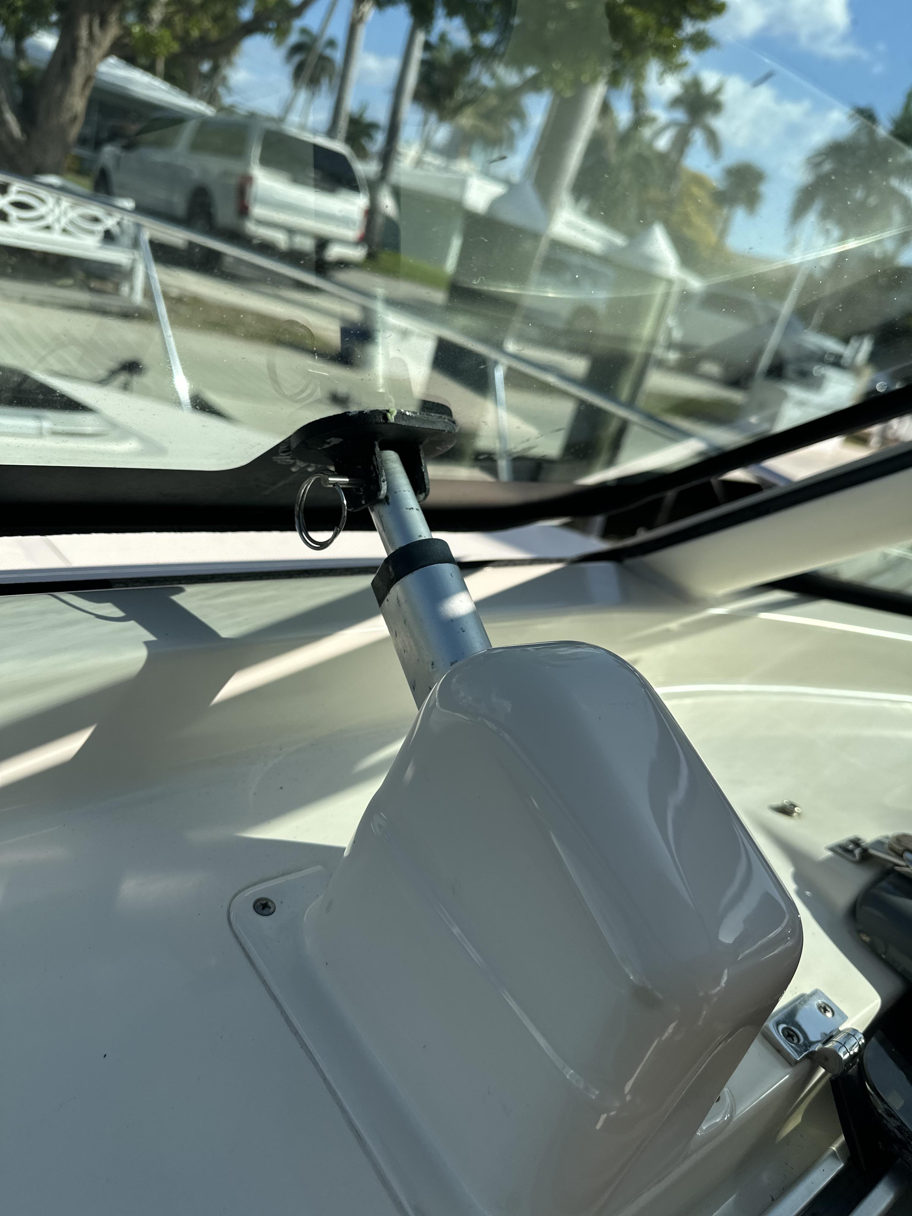 Close-up of 2008 Pursuit 315 Offshore boat interior detail with windshield wiper mechanism.