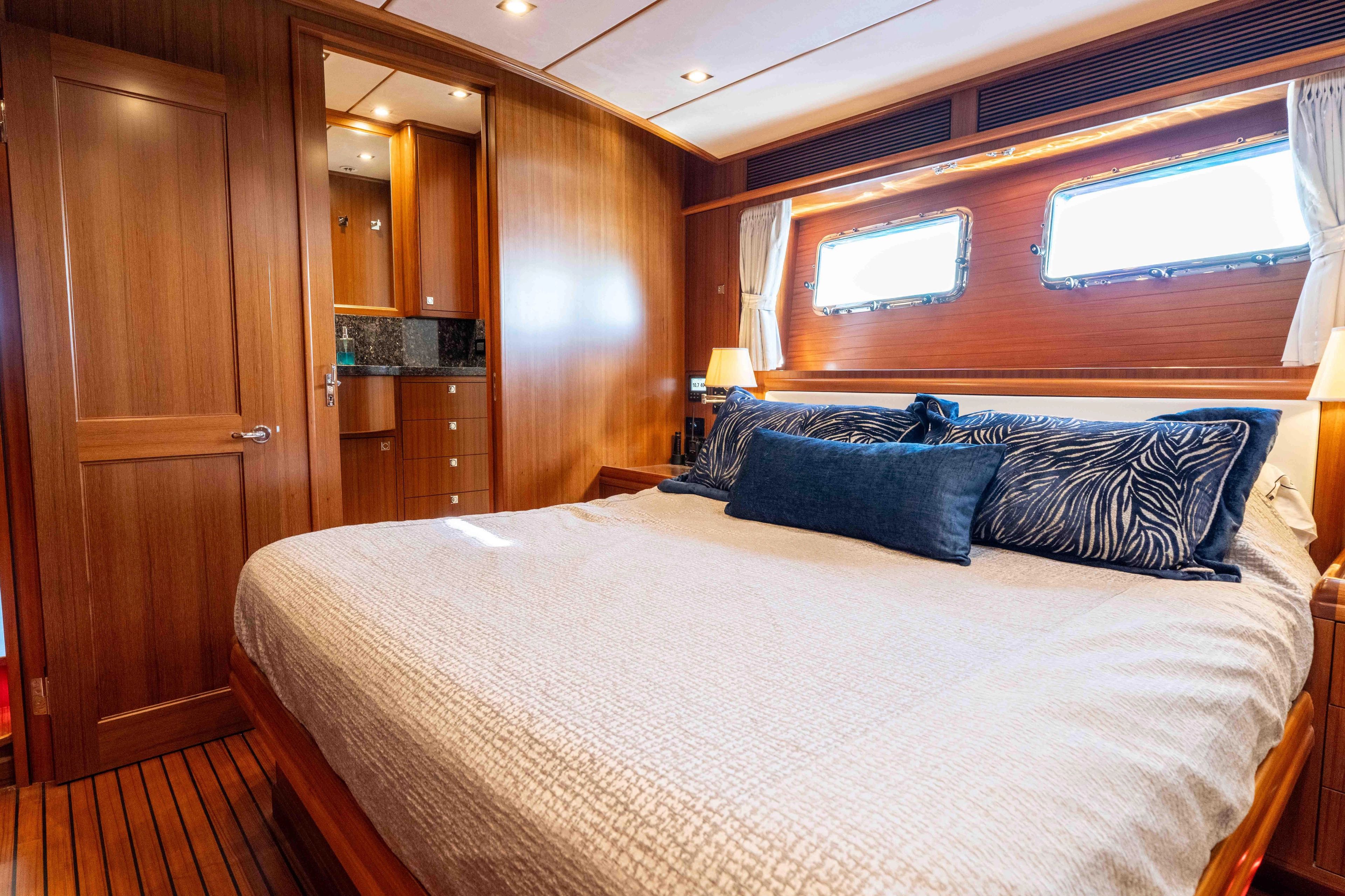 Luxurious bedroom on the Nordhavn 63 yacht, model year 2022.