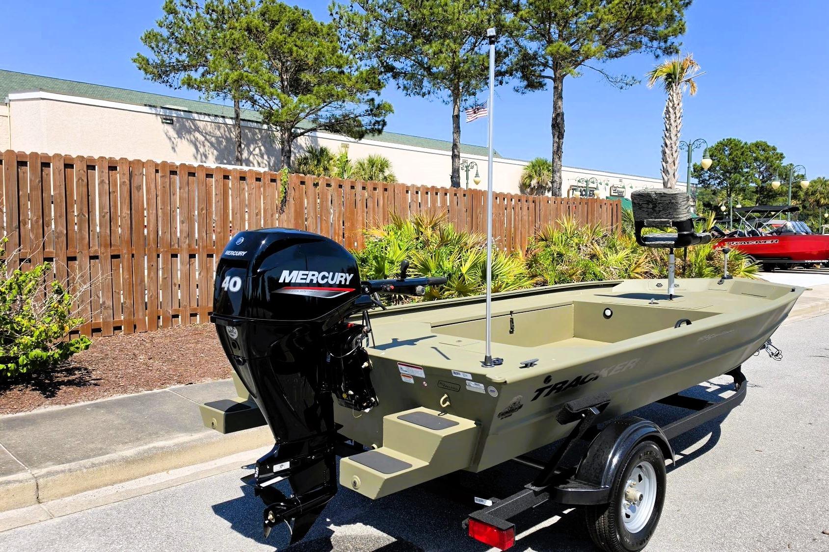 2026 Tracker Grizzly 1654 T Sportsman boat with Mercury 40 engine on trailer.