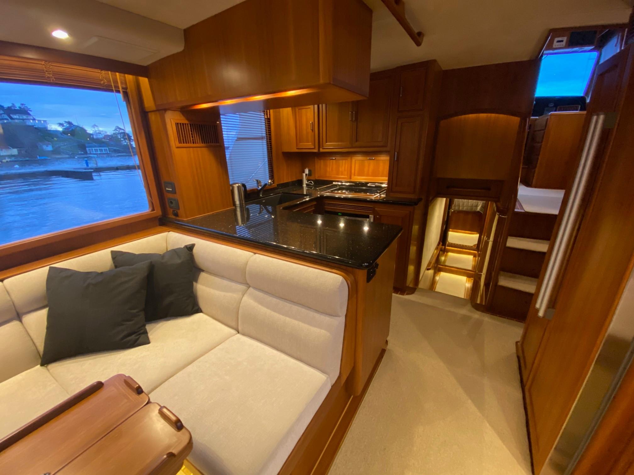 Interior of a 2018 Fleming 55 yacht with modern kitchen.