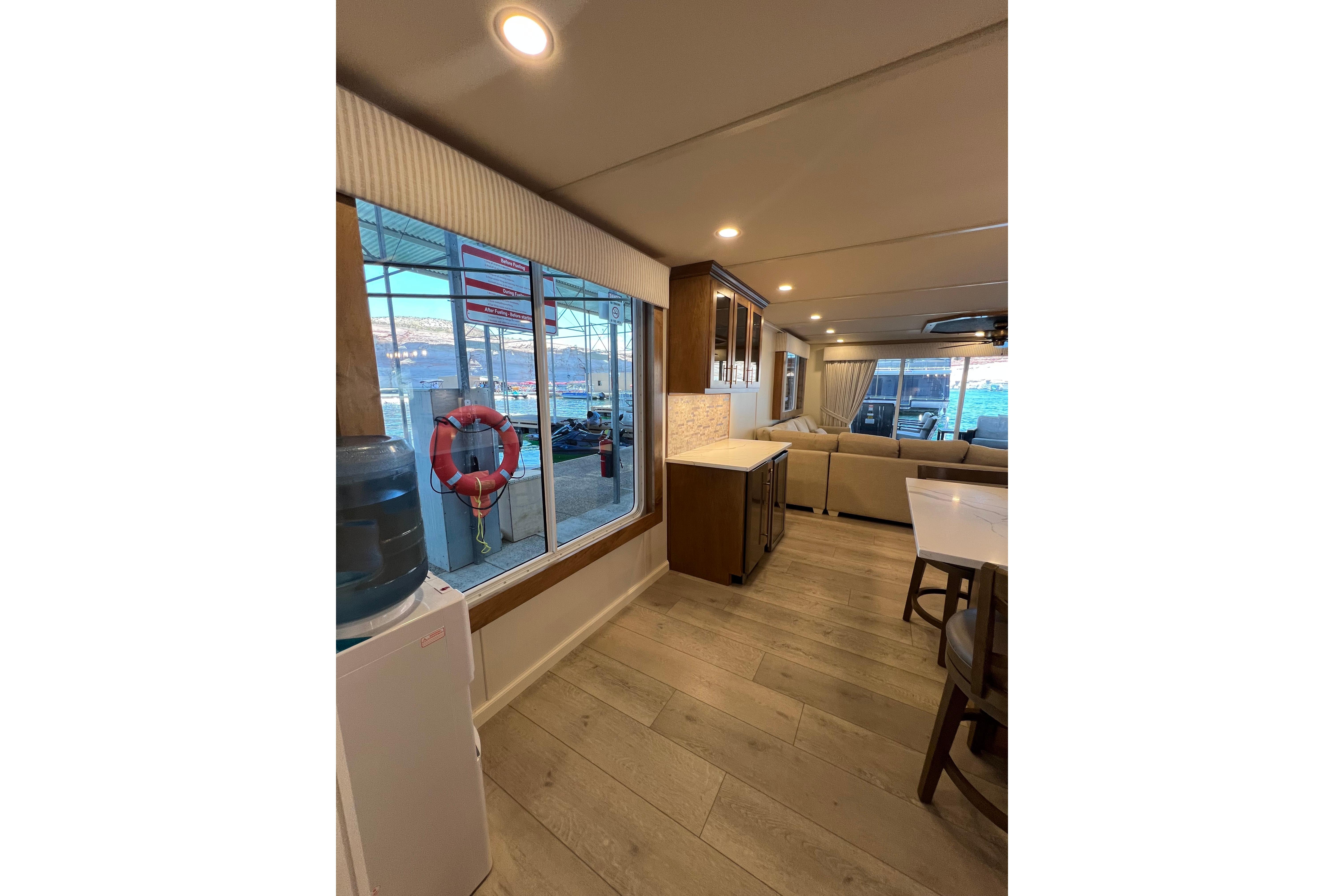 Luxurious interior of 2025 Sumerset Excellence Multiple Shares houseboat with modern furnishings and large windows.