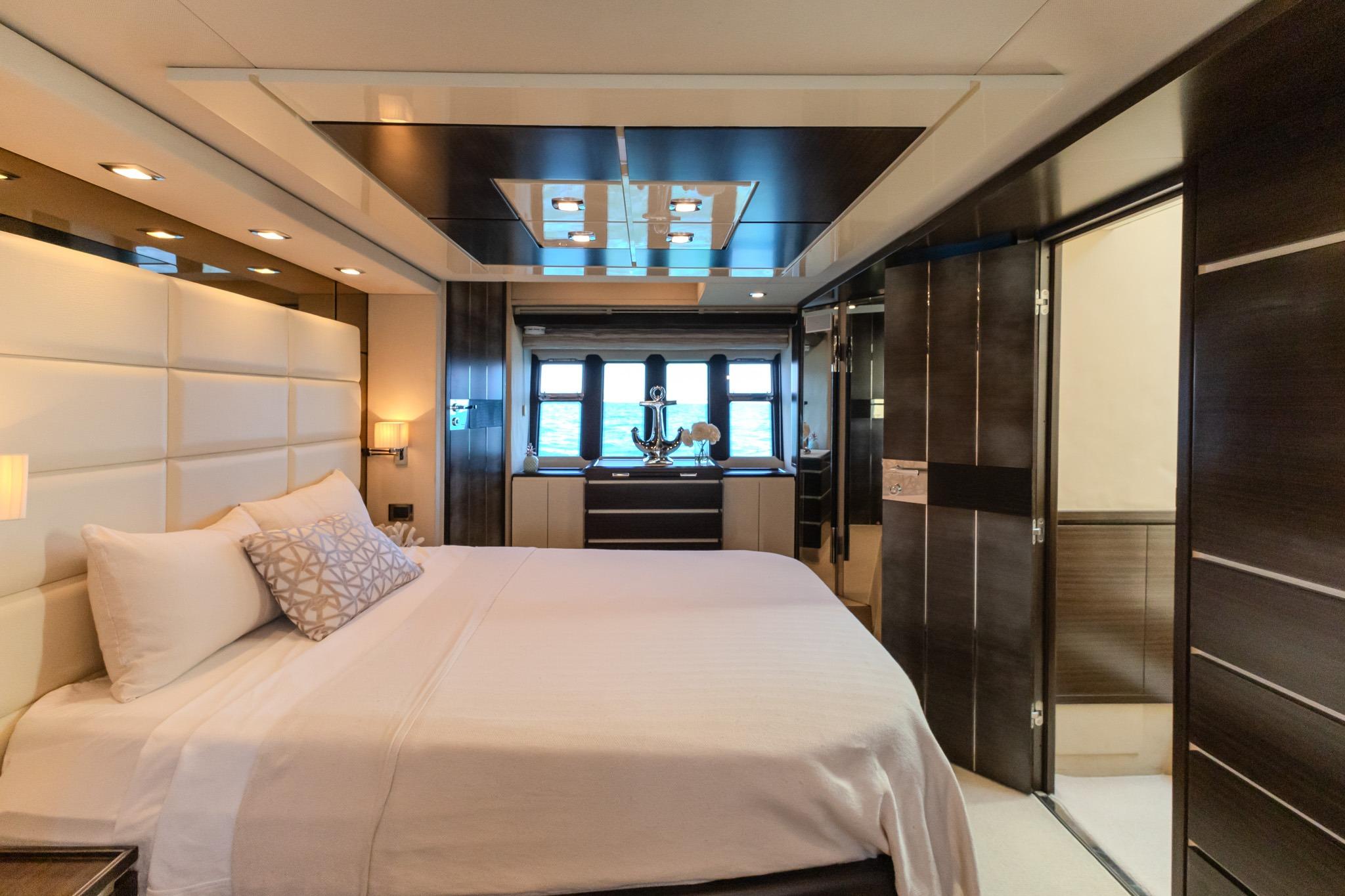 Luxurious bedroom interior on 2013 Azimut Fly 72 yacht, featuring elegant design and modern amenities.