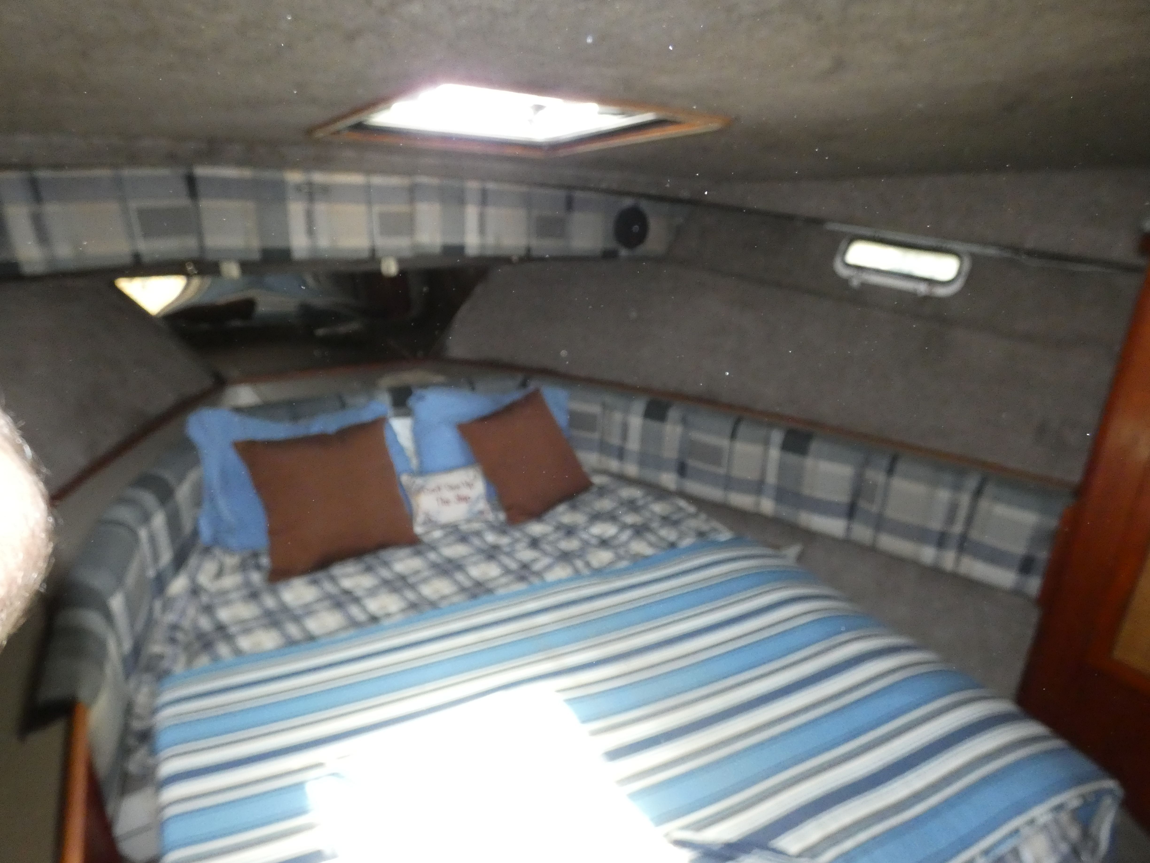 Interior of 1984 Bayliner 3870 Motoryacht with cozy bed.