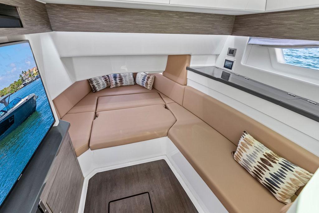 Luxurious interior of 2022 Aviara AV40 OB boat with plush seating and modern design.
