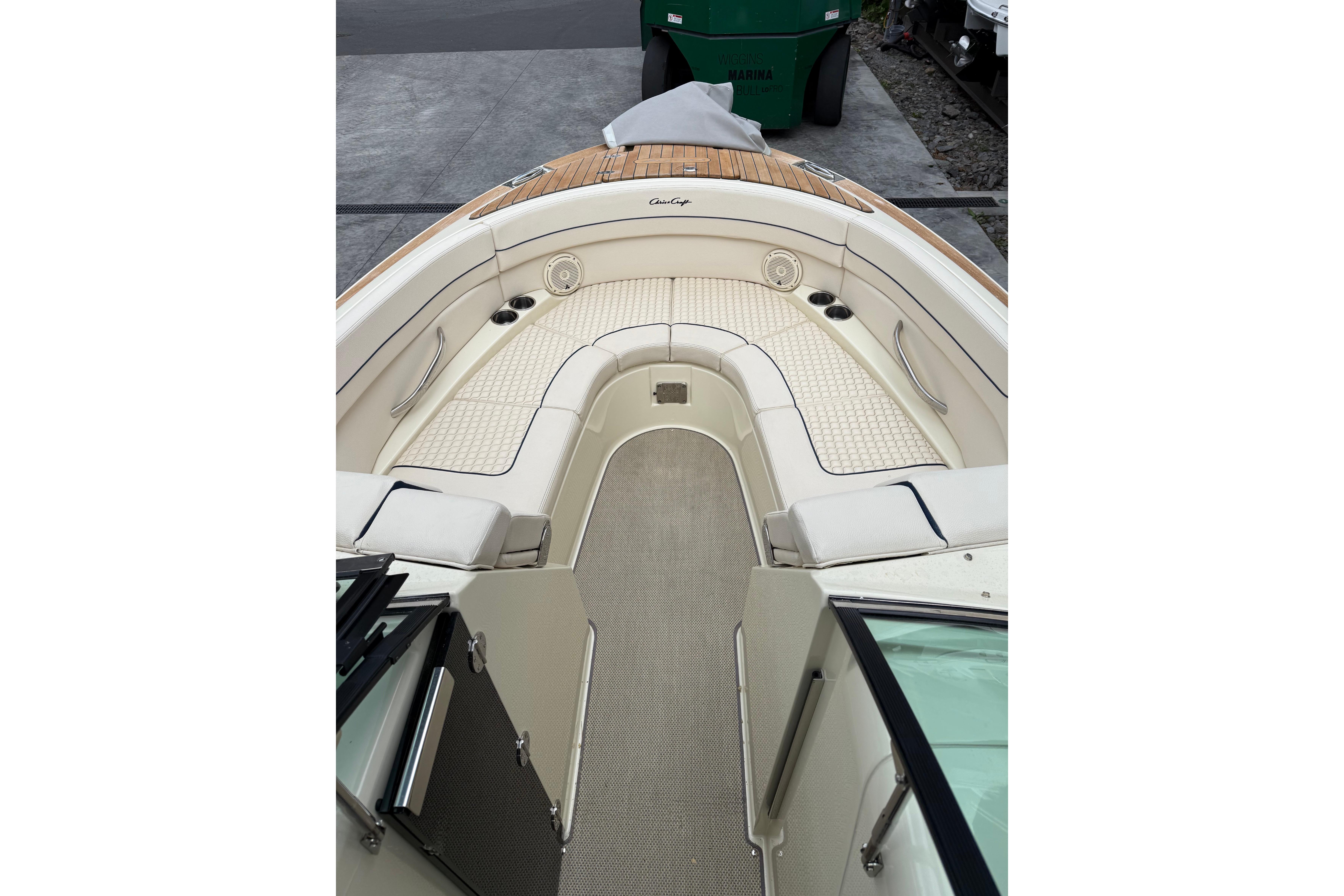 2019 Chris-Craft Launch 28 GT boat interior with elegant seating and teak accents.