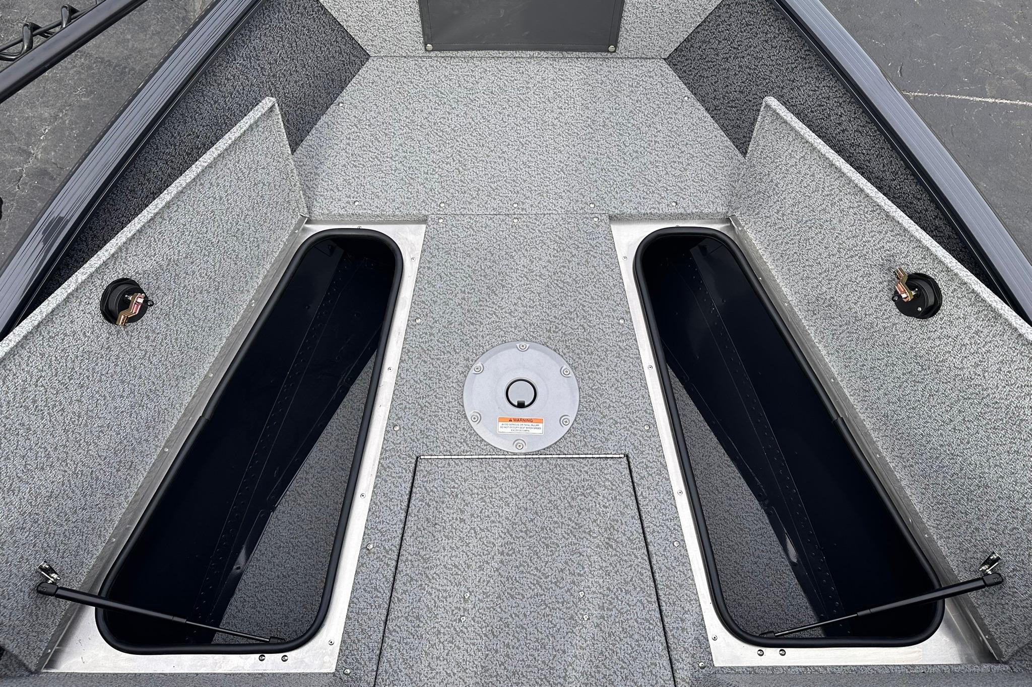 2026 Lund 1775 Adventure Sport boat interior with open storage compartments.