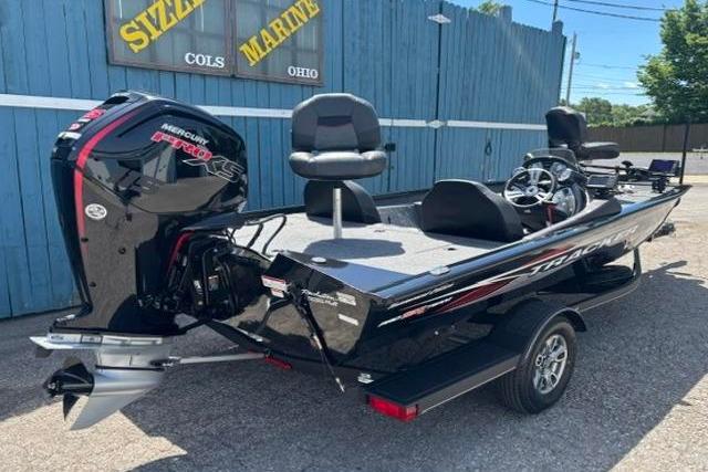 2023 Tracker Pro Team 190 TX Tournament Edition boat with Mercury engine, parked outdoors.