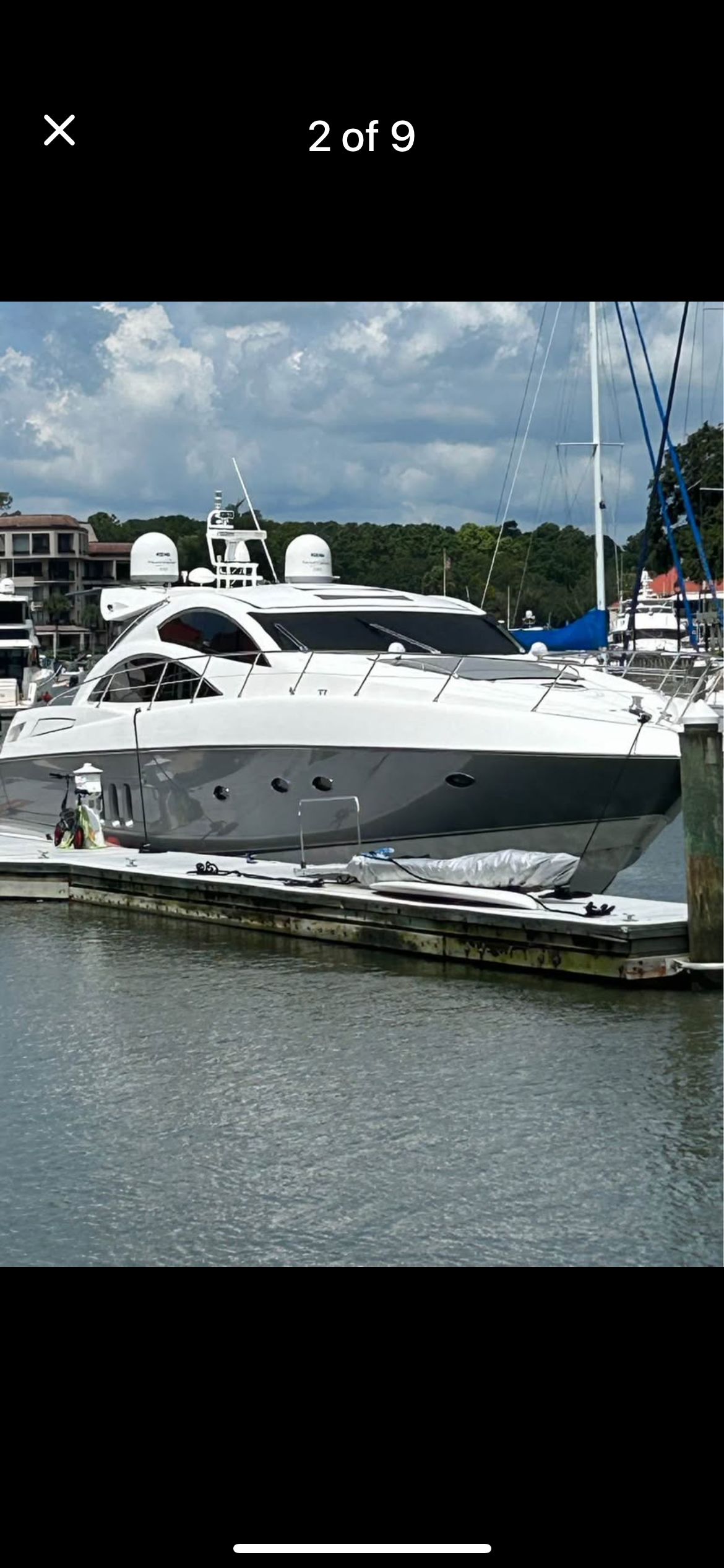 2008 Sunseeker Predator 62 yacht docked at marina.