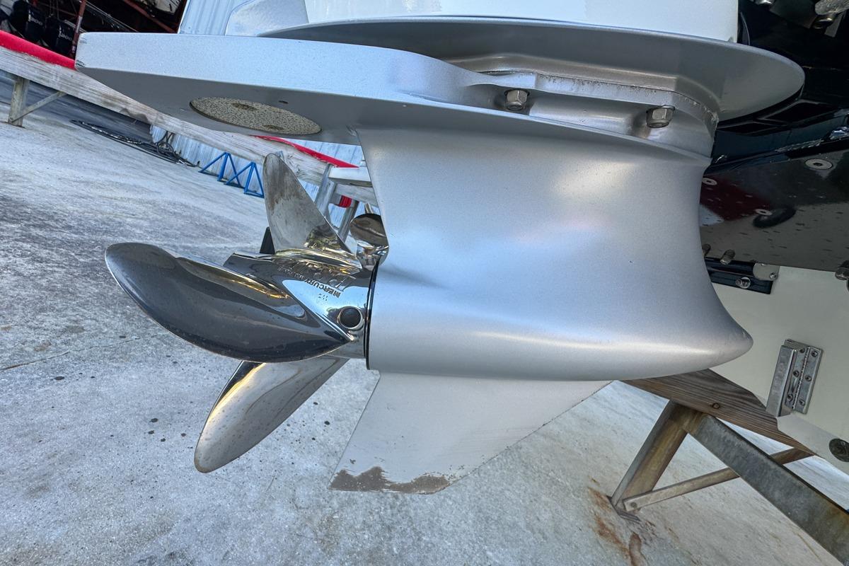 2022 Velocity 290sc boat propeller, close-up view, showcasing sleek metallic design.