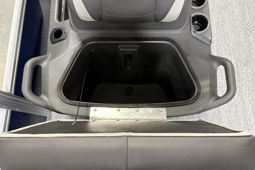 2026 Sun Tracker Bass Buggy 18 DLX storage compartment with cup holders and seating.
