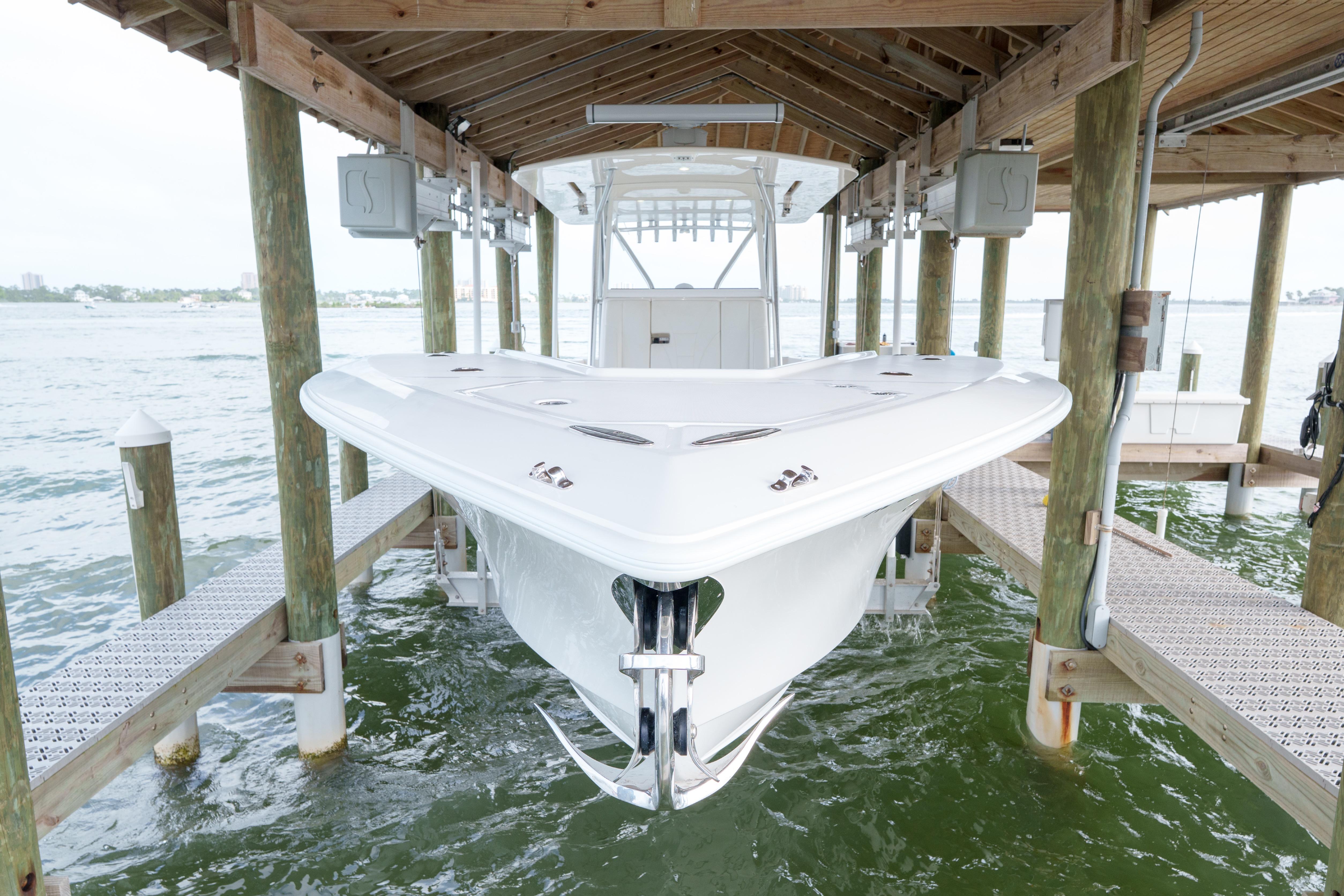 2022 SeaVee 370Z boat docked in a covered marina slip.