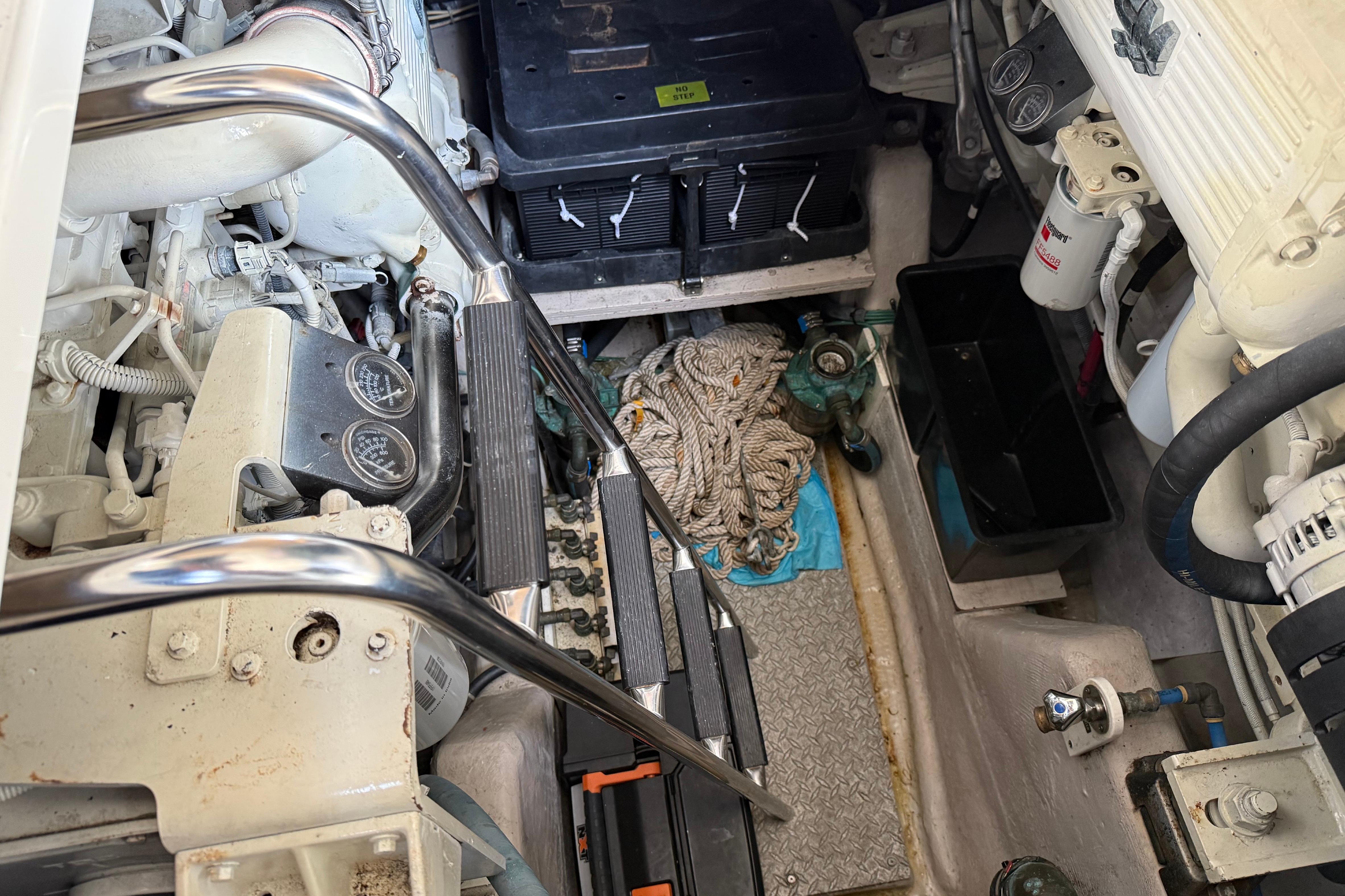 Engine room of 2008 Sea Ray 47 Sedan Bridge with equipment and ropes.