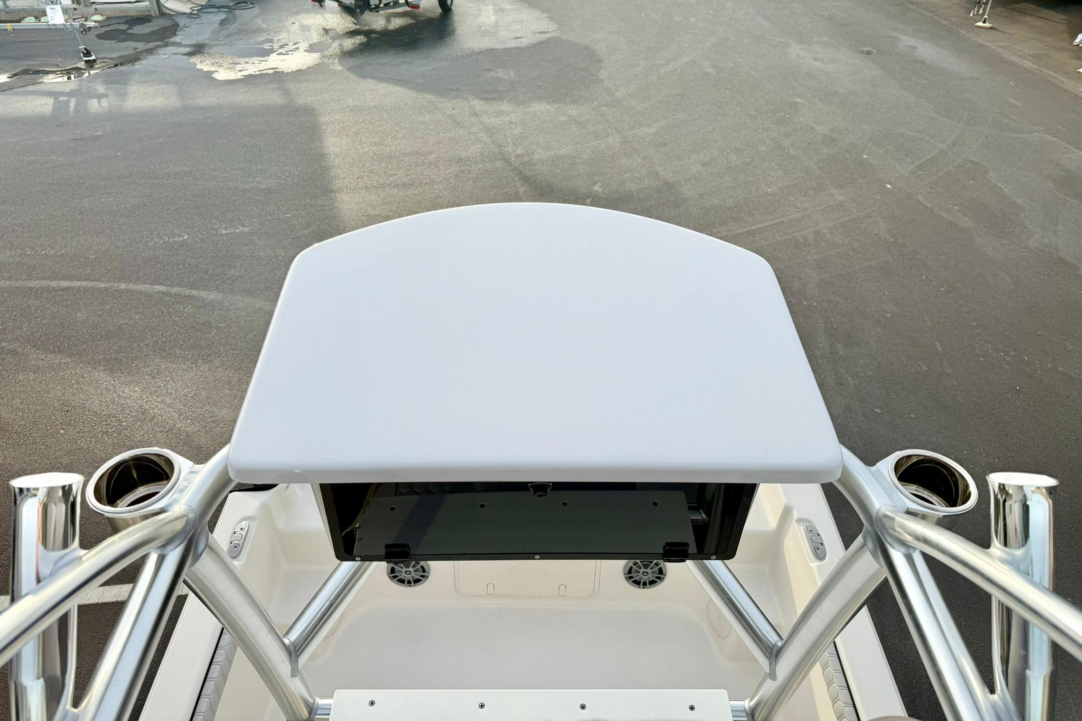 2025 Carolina Skiff 21 LS boat console with T-top and rod holders.