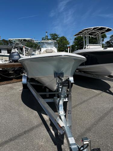 2024 Key West 188 Bay Reef boat on a trailer under a clear blue sky.