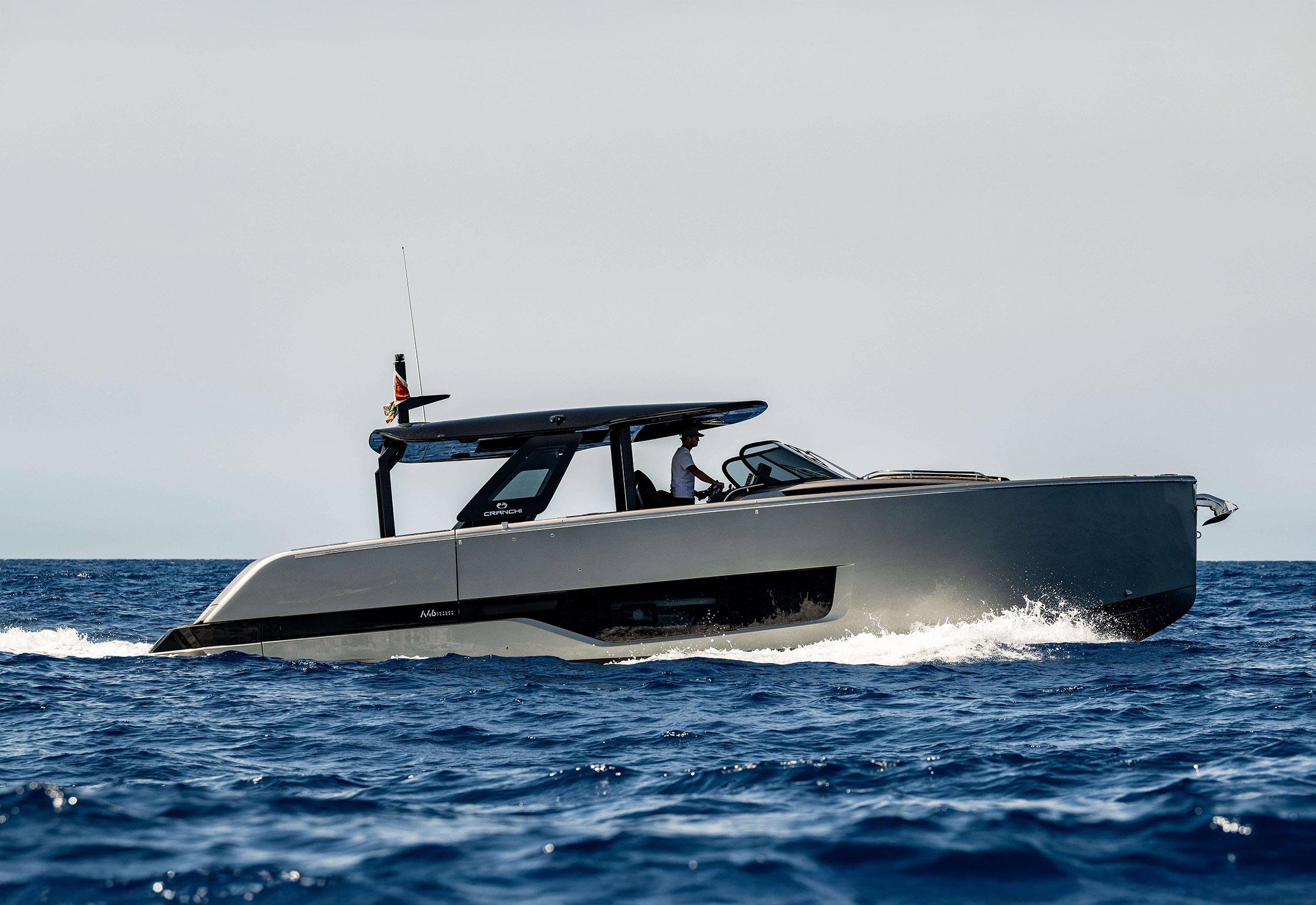 2022 Cranchi A46 yacht cruising on open sea under clear sky.
