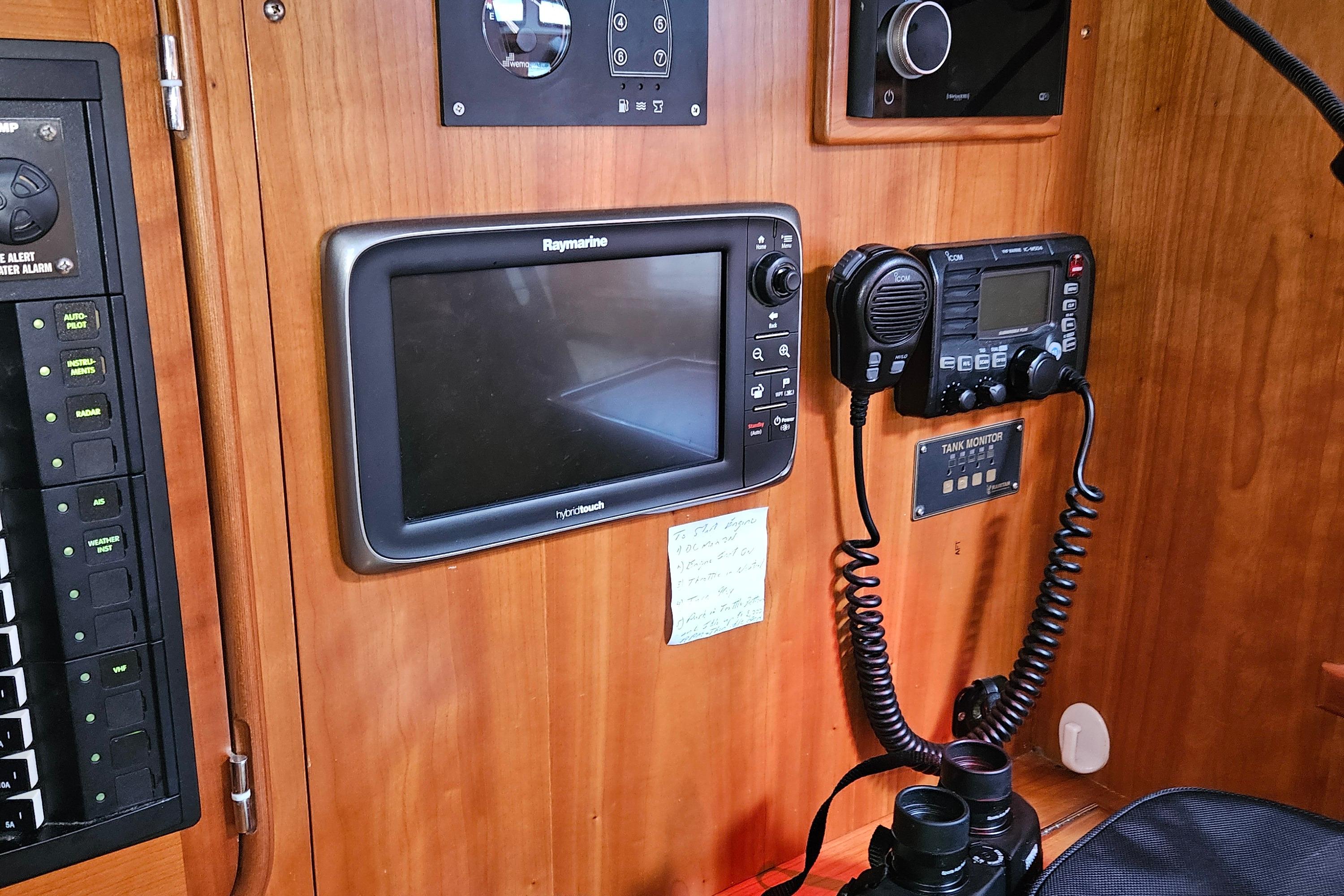 Navigation equipment on 2013 Passport 470 Center Cockpit yacht, featuring Raymarine and Icom devices.