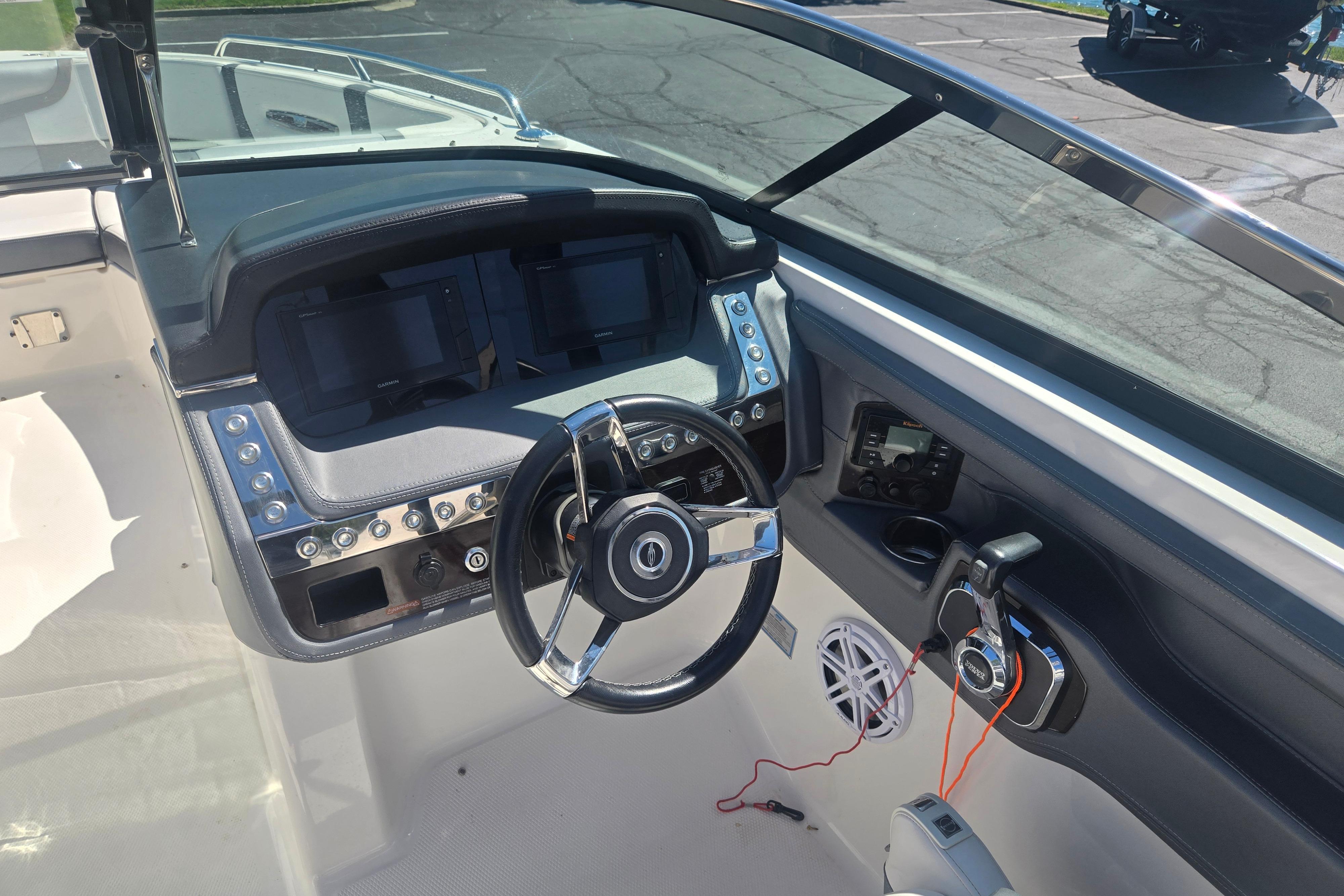 Cockpit view of 2018 Chaparral 267 SSX boat with modern steering and controls.