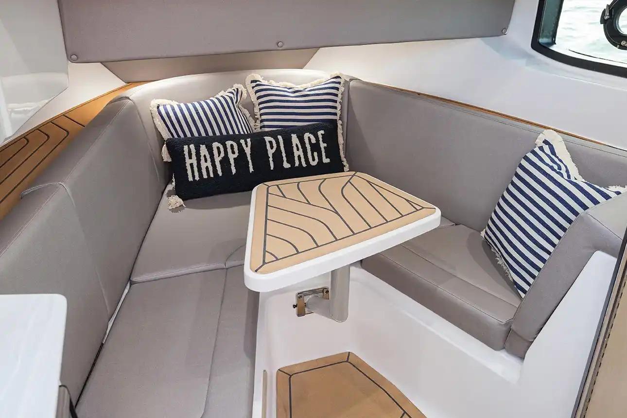 Manufacturer Provided Image: 2026 Hurricane SunDeck 3200 OB interior with cozy seating and decorative pillows.