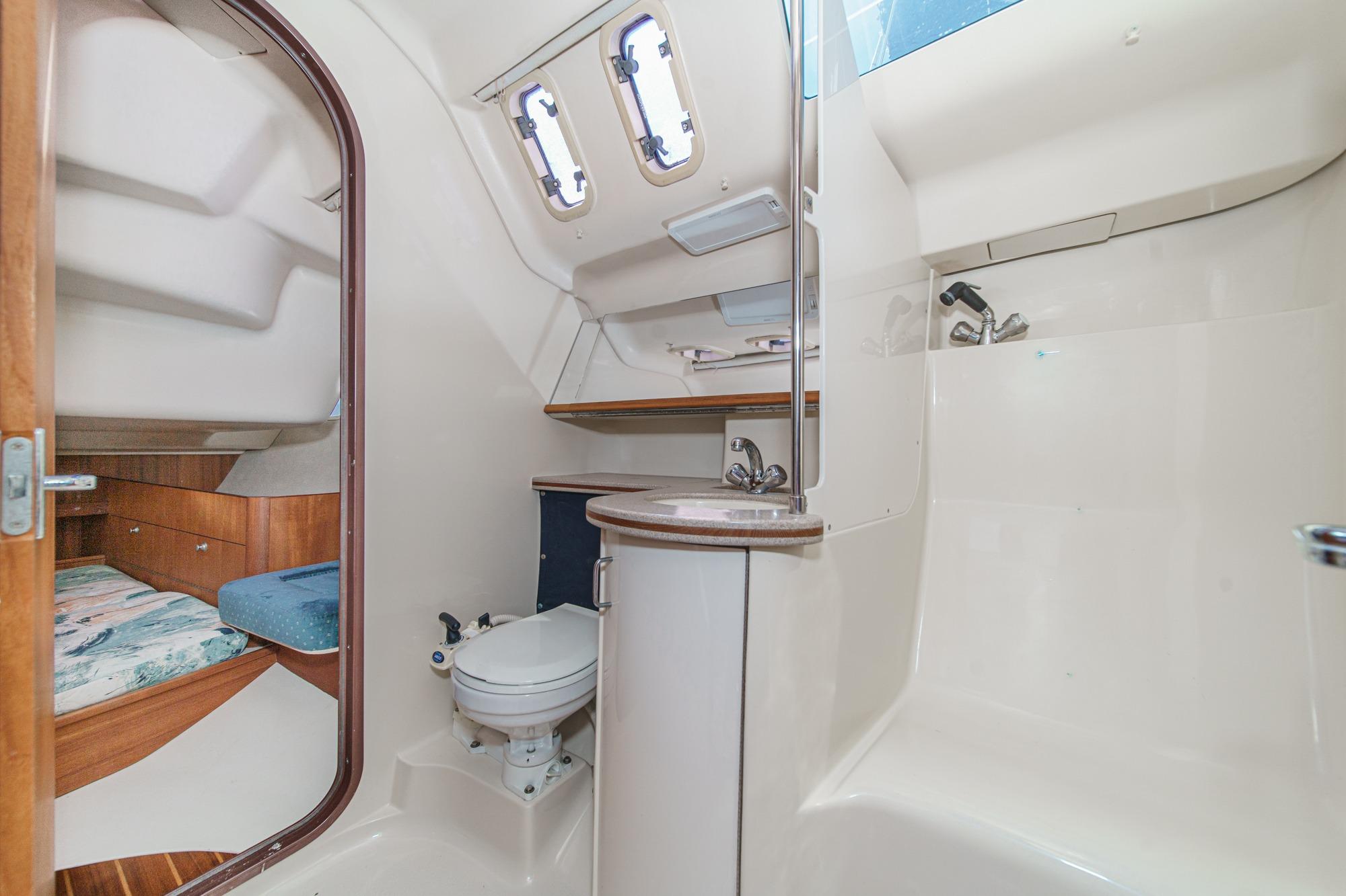 Interior of 1996 Hunter 376 sailboat featuring bathroom and cabin area.