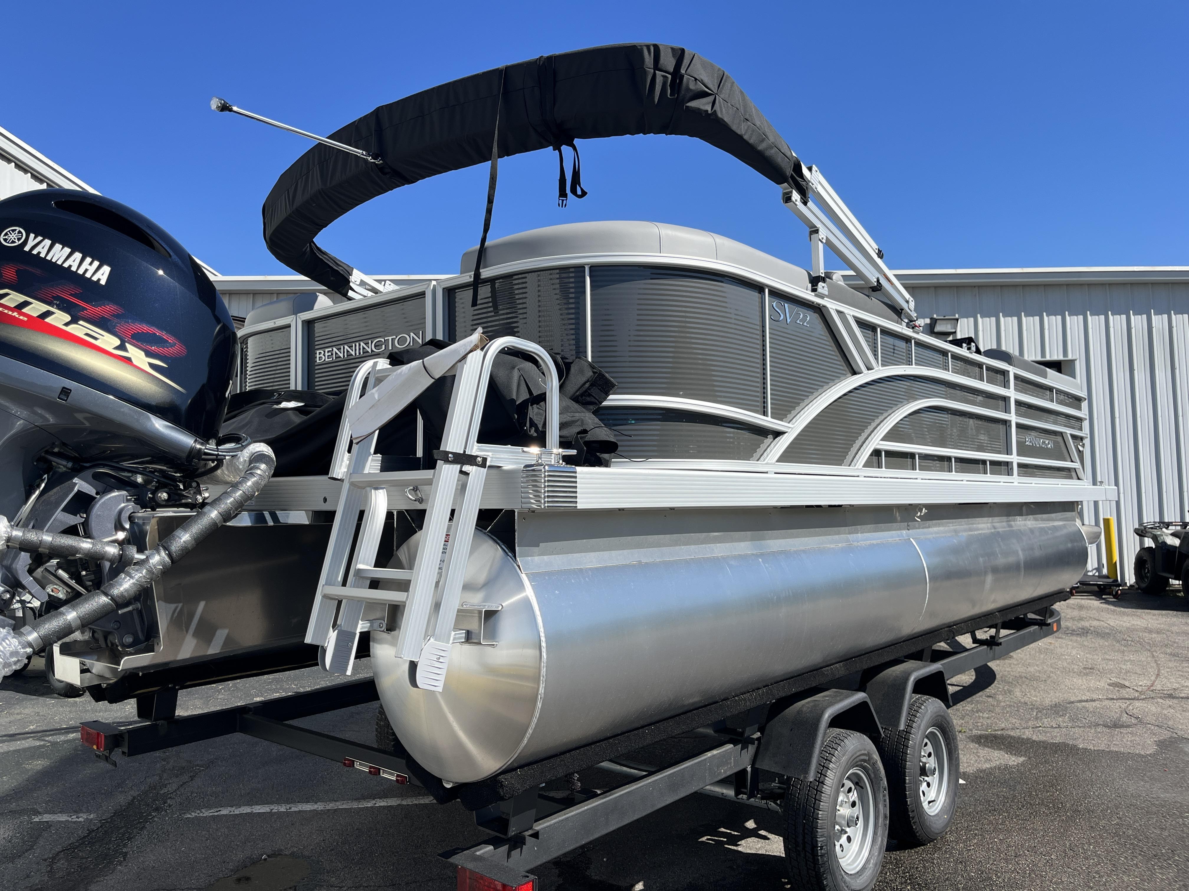 2024 Bennington 22 SVSR pontoon boat on trailer with Yamaha outboard motor.