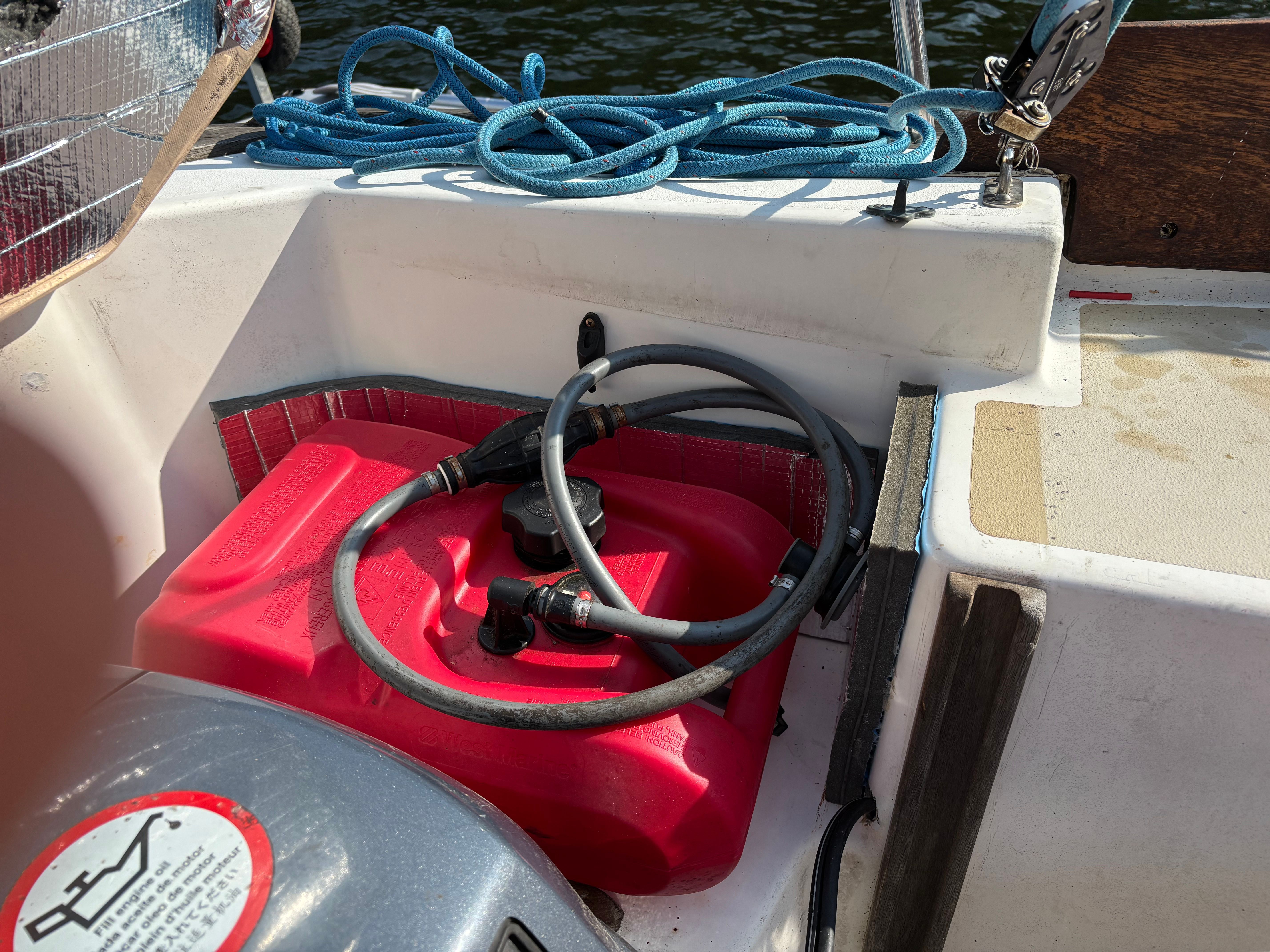 Red fuel tank on Cape Dory 26 sailboat, year 1986.