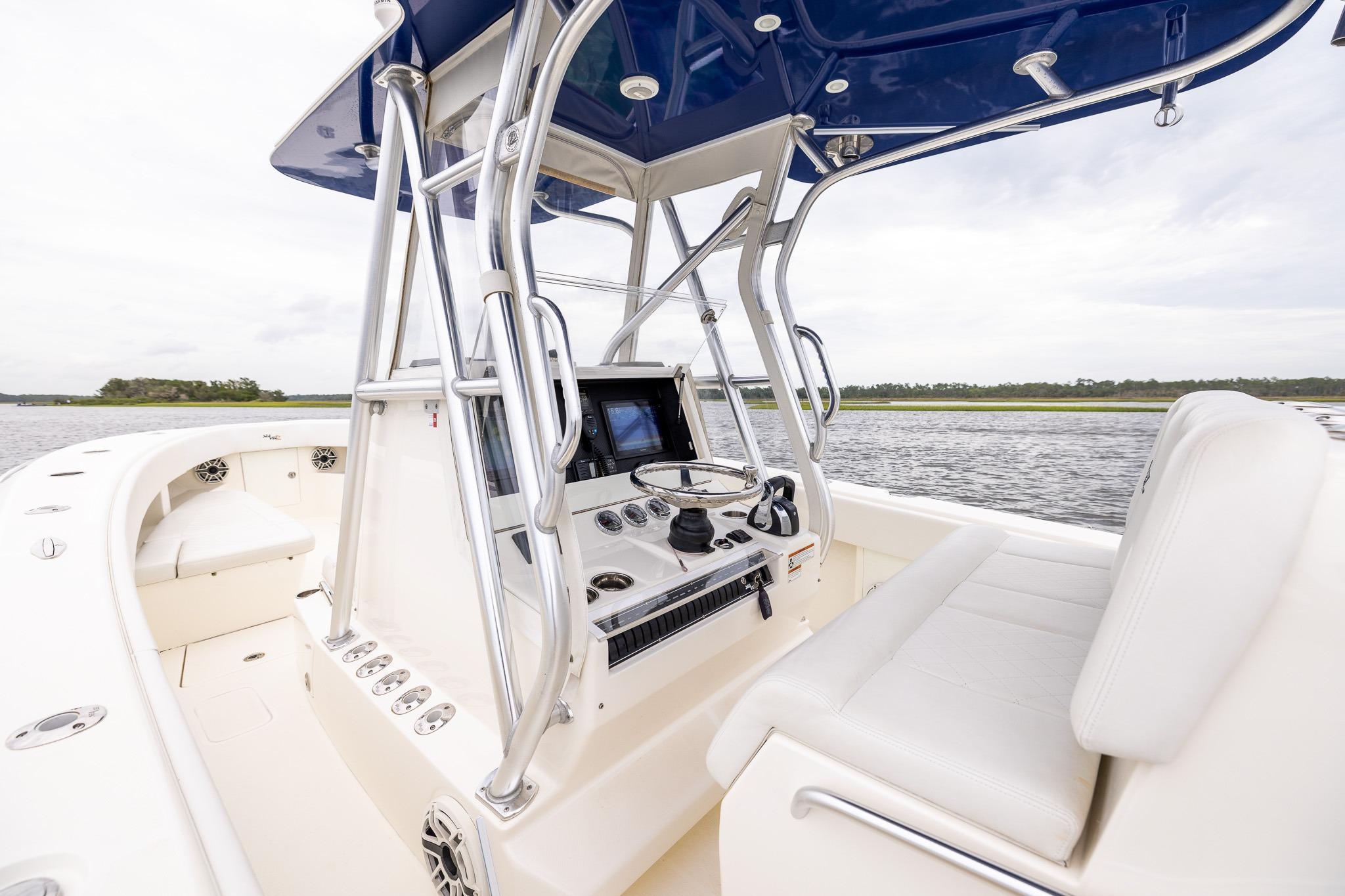 2019 SeaVee 322Z boat cockpit with modern controls and seating on open water.