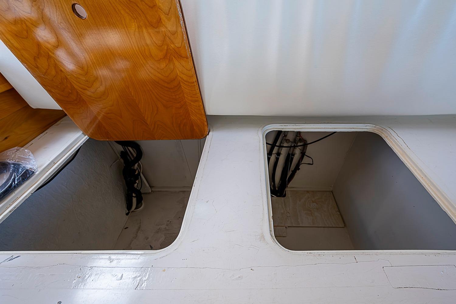 Interior compartments of 2003 Magna Marine Nova Scotia 47 boat, featuring wooden and white surfaces.